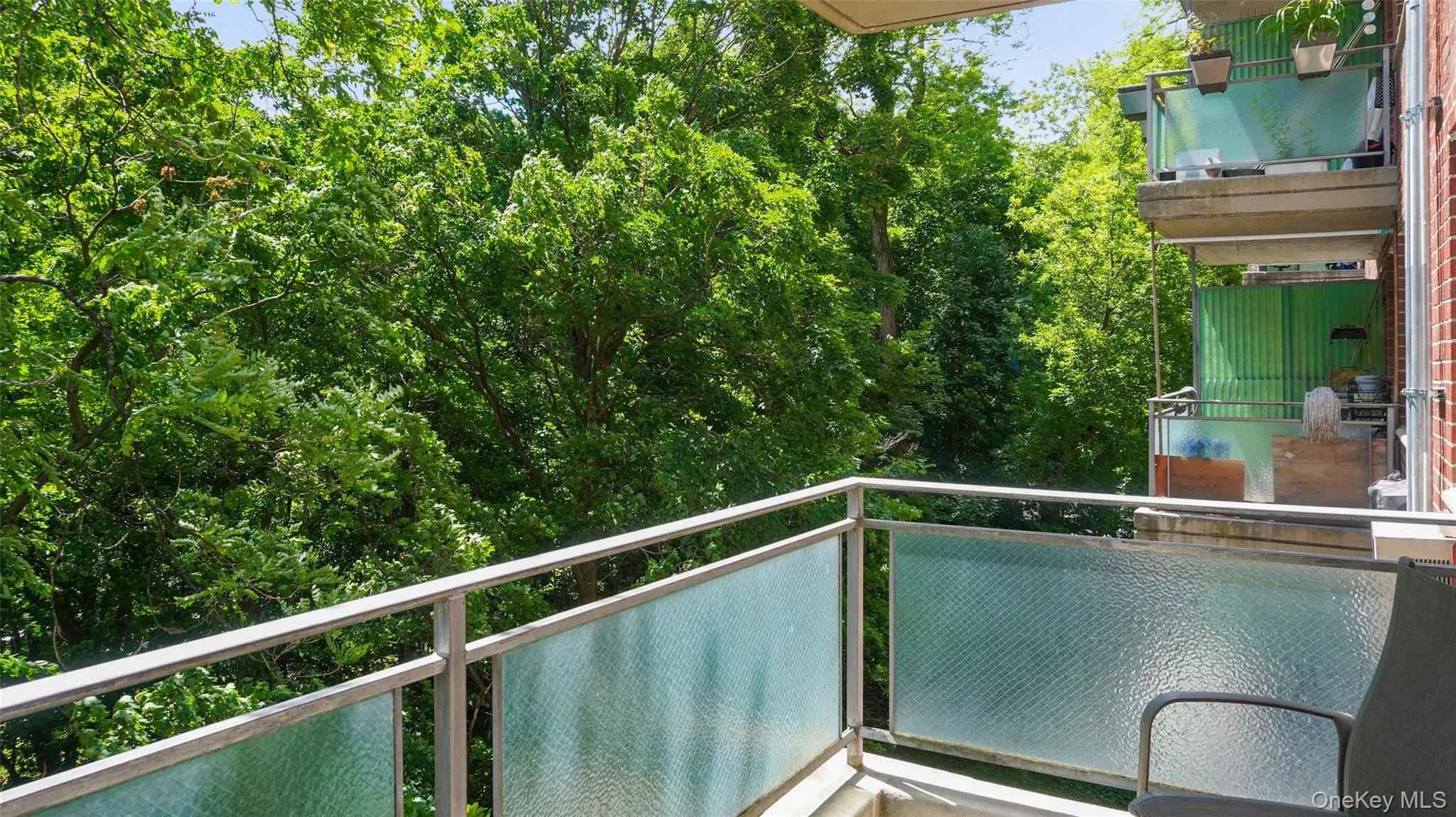 Enjoy tree-lined views from your private balcony. Enjoy tree-lined views from your private balcony.