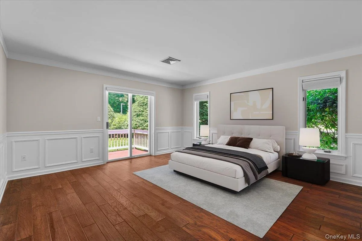 Virtually-staged Primary Bedroom w/Sliders to Deck Virtually-staged Primary Bedroom w/Sliders to Deck
