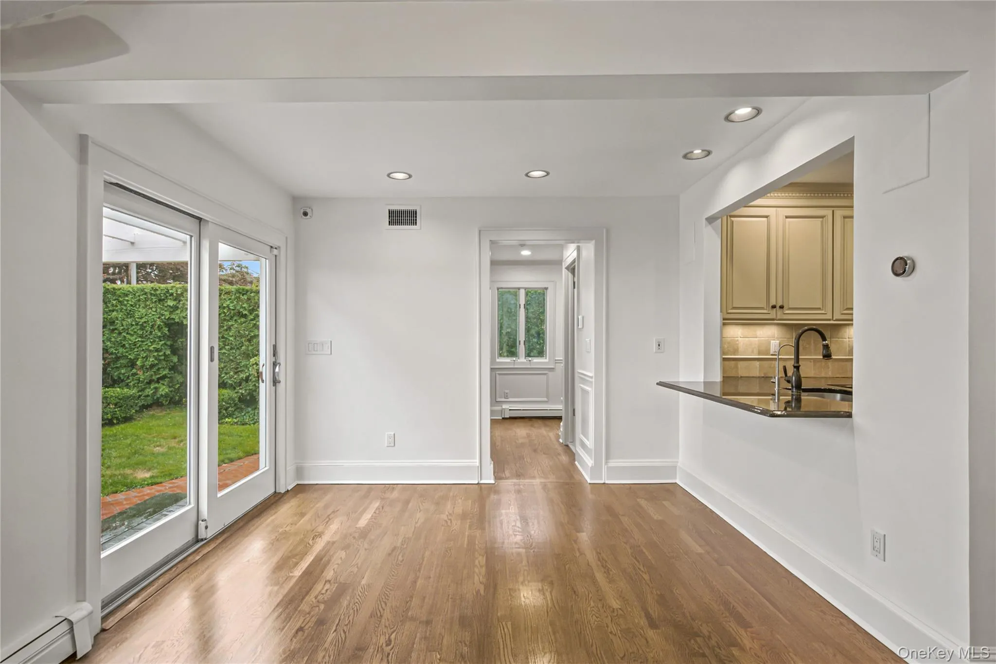 Kitchen area overlooking glass doors to backyard Kitchen area overlooking glass doors to backyard