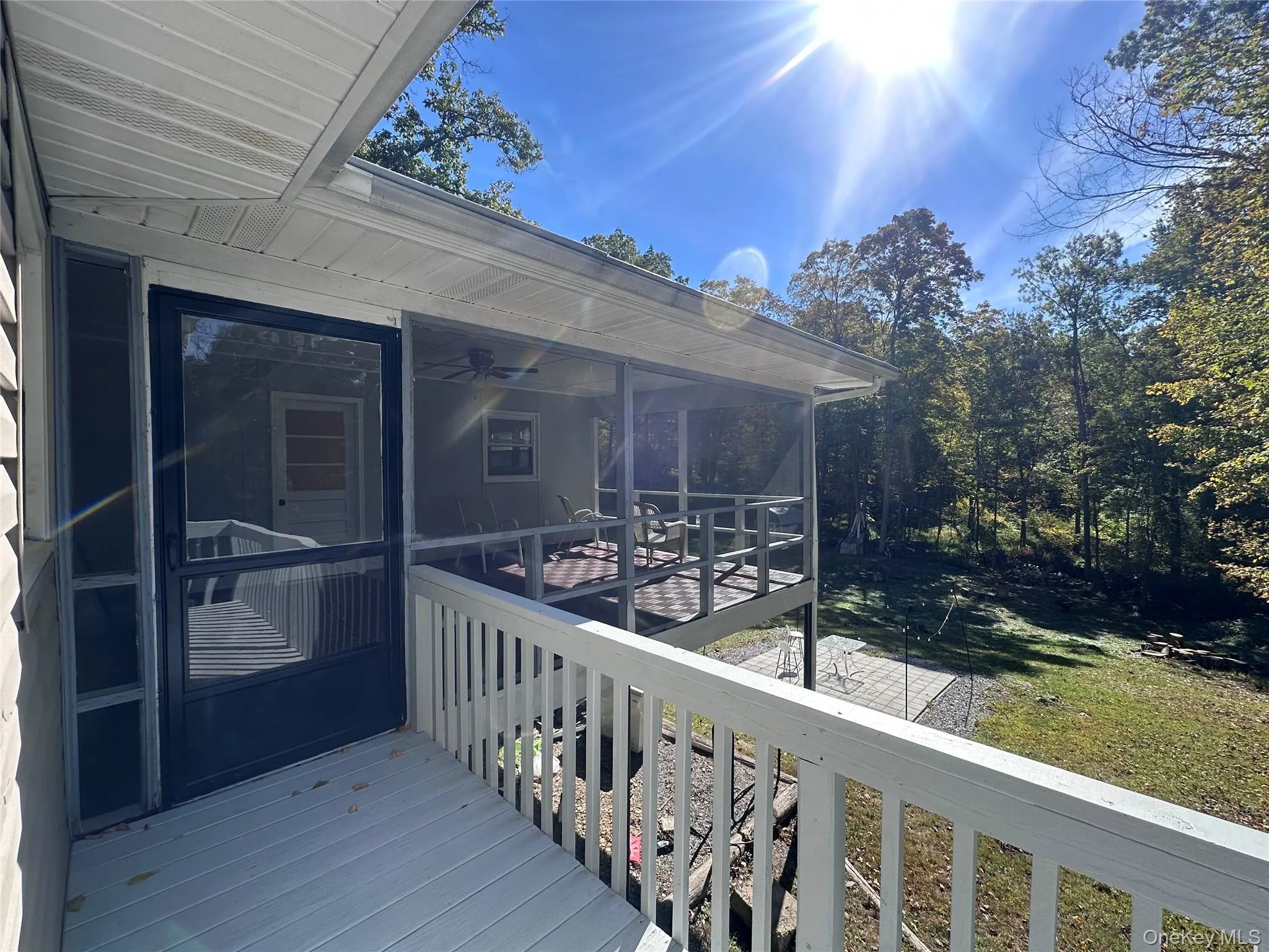 Deck wraps from dining area to three season room Deck wraps from dining area to three season room