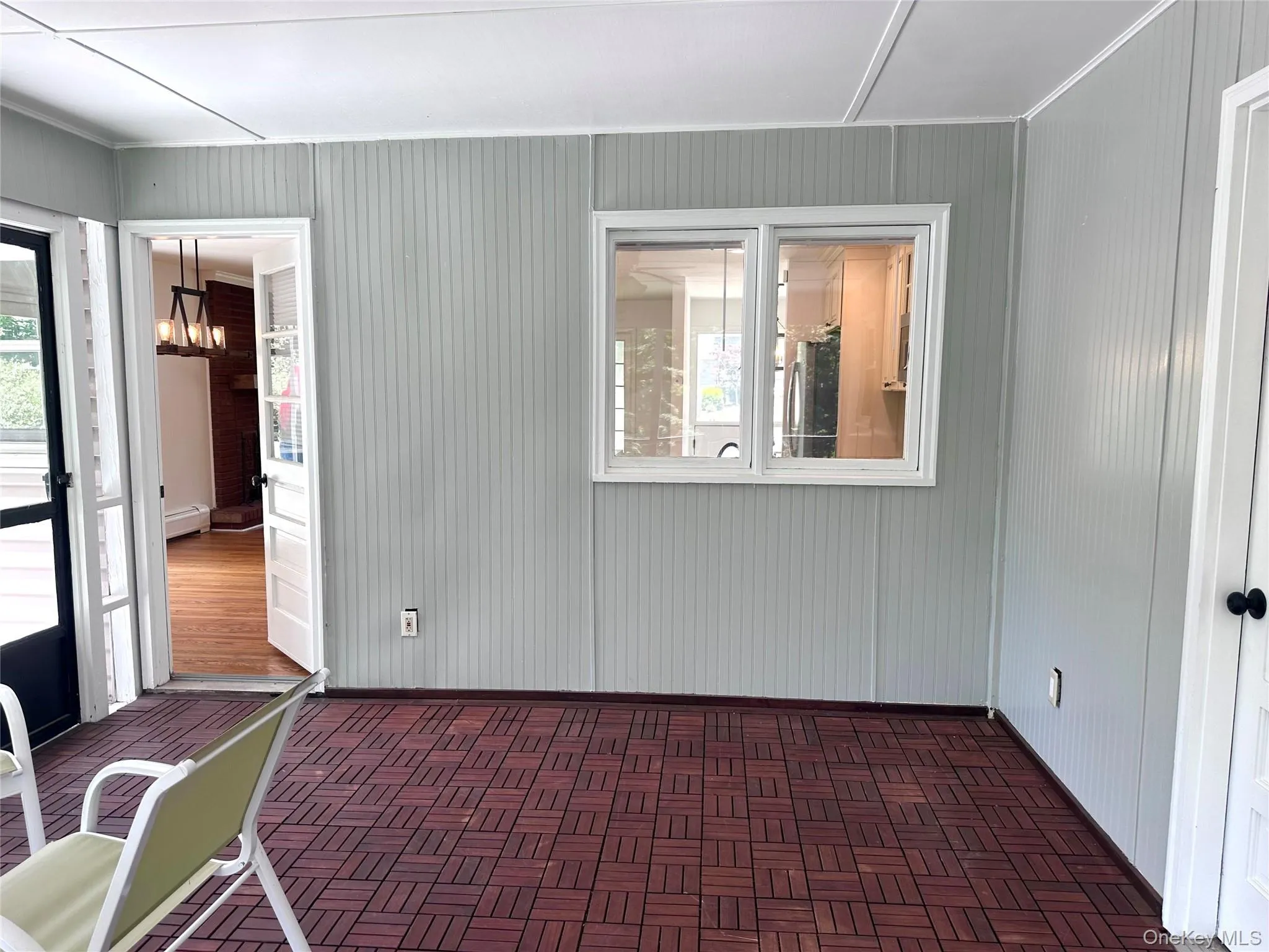 Sunroom view into main area. Sunroom view into main area.