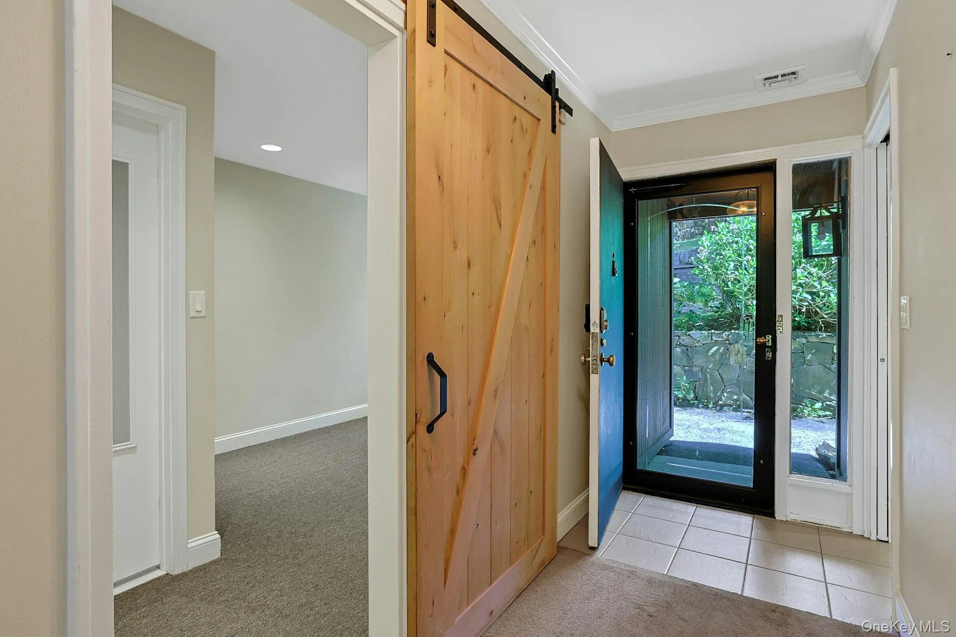 Den with sliding barn door just off the front entry foyer Den with sliding barn door just off the front entry foyer