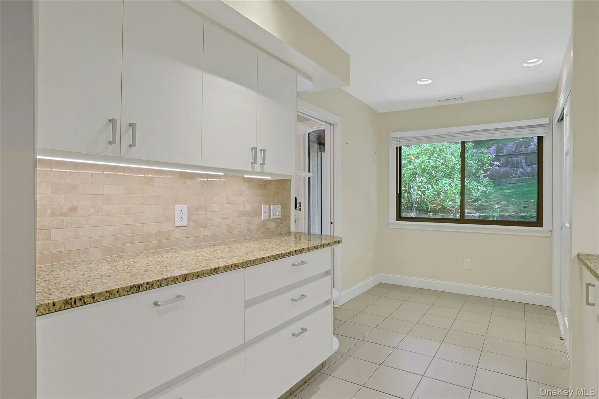 Additional counter space and storage and a windowed breakfast nook with large pantry to the right Additional counter space and storage and a windowed breakfast nook with large pantry to the right