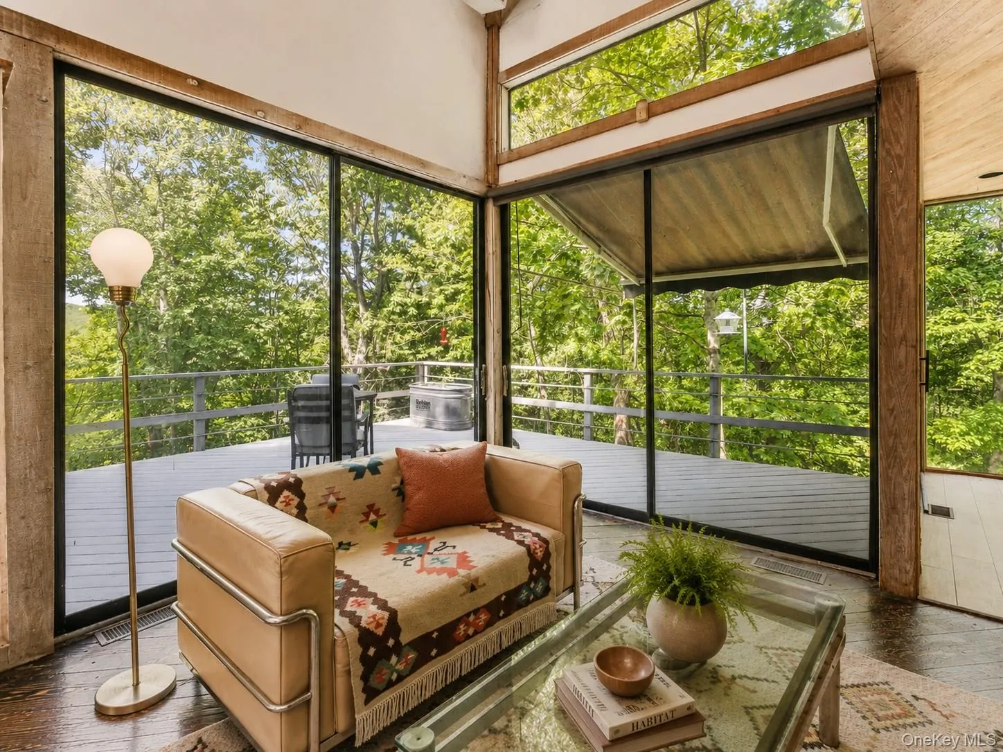 Spacious Living room with cathedral ceilings, floor to ceiling windows, sliding glass doors and a beautiful stone fireplace Spacious Living room with cathedral ceilings, floor to ceiling windows, sliding glass doors and a beautiful stone fireplace