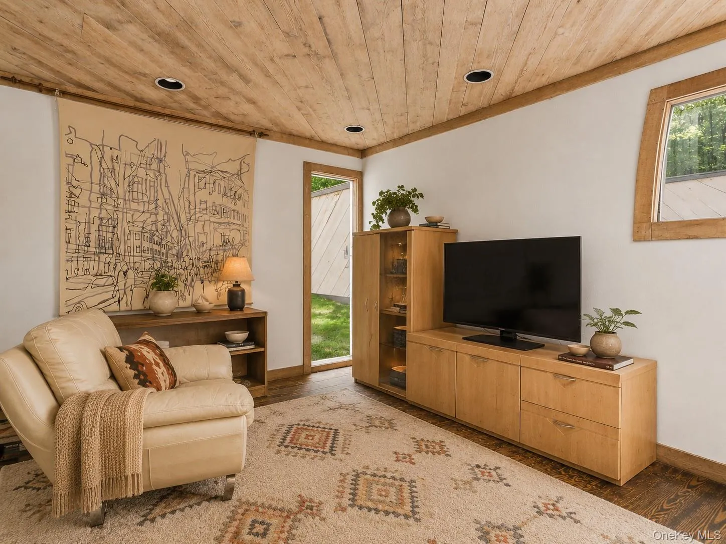 Spacious Living room with cathedral ceilings, floor to ceiling windows, sliding glass doors and a beautiful stone fireplace Spacious Living room with cathedral ceilings, floor to ceiling windows, sliding glass doors and a beautiful stone fireplace