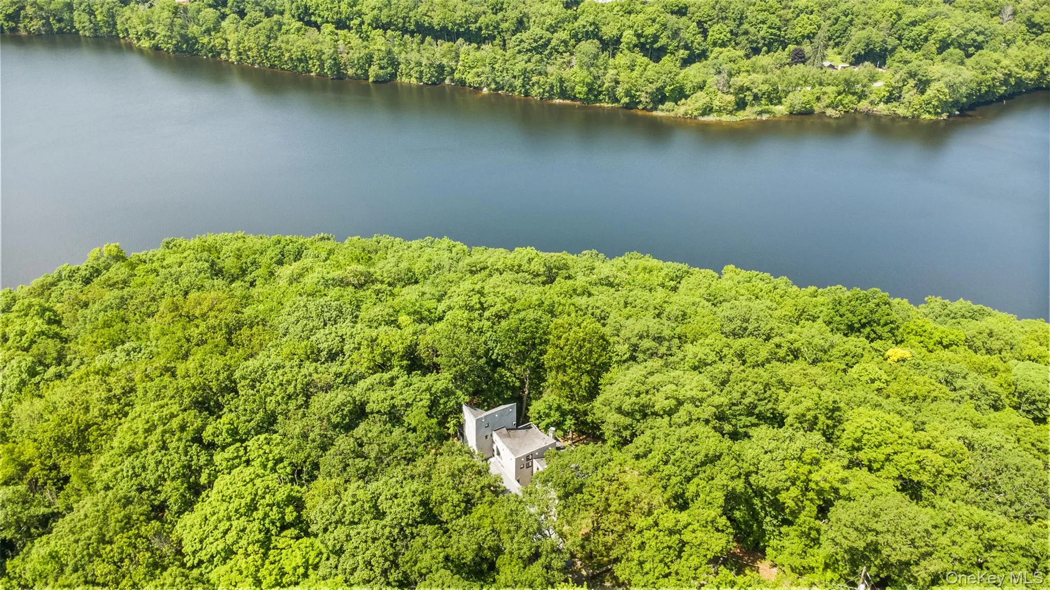Aerial perspective of a truly unique estate, set on 6 private acres and surrounded by 30 + acres of protected natural beauty. From above, the home’s impressive scale, distinctive design, and extraordinary setting come into full view, with reservoirs nearby and a remarkable sense of peace, privacy, and seclusion in every direction. Aerial perspective of a truly unique estate, set on 6 private acres and surrounded by 30 + acres of protected natural beauty. From above, the home’s impressive scale, distinctive design, and extraordinary setting come into full view, with reservoirs nearby and a remarkable sense of peace, privacy, and seclusion in every direction.