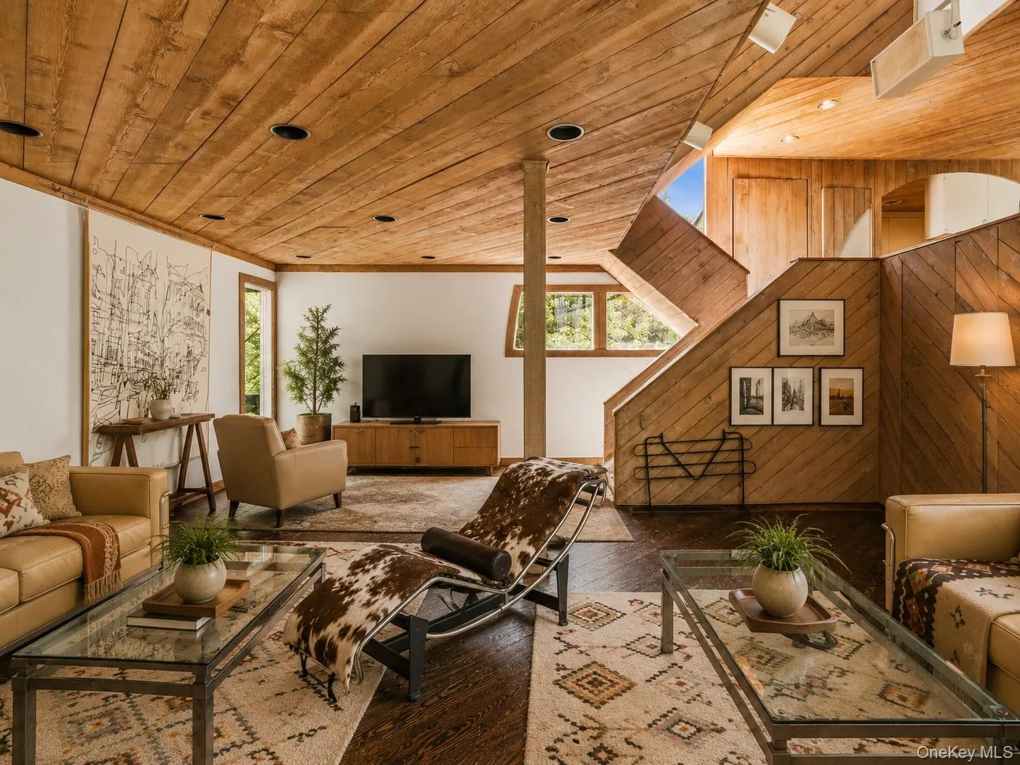 Spacious Living room with cathedral ceilings, floor to ceiling windows, sliding glass doors and a beautiful stone fireplace Spacious Living room with cathedral ceilings, floor to ceiling windows, sliding glass doors and a beautiful stone fireplace