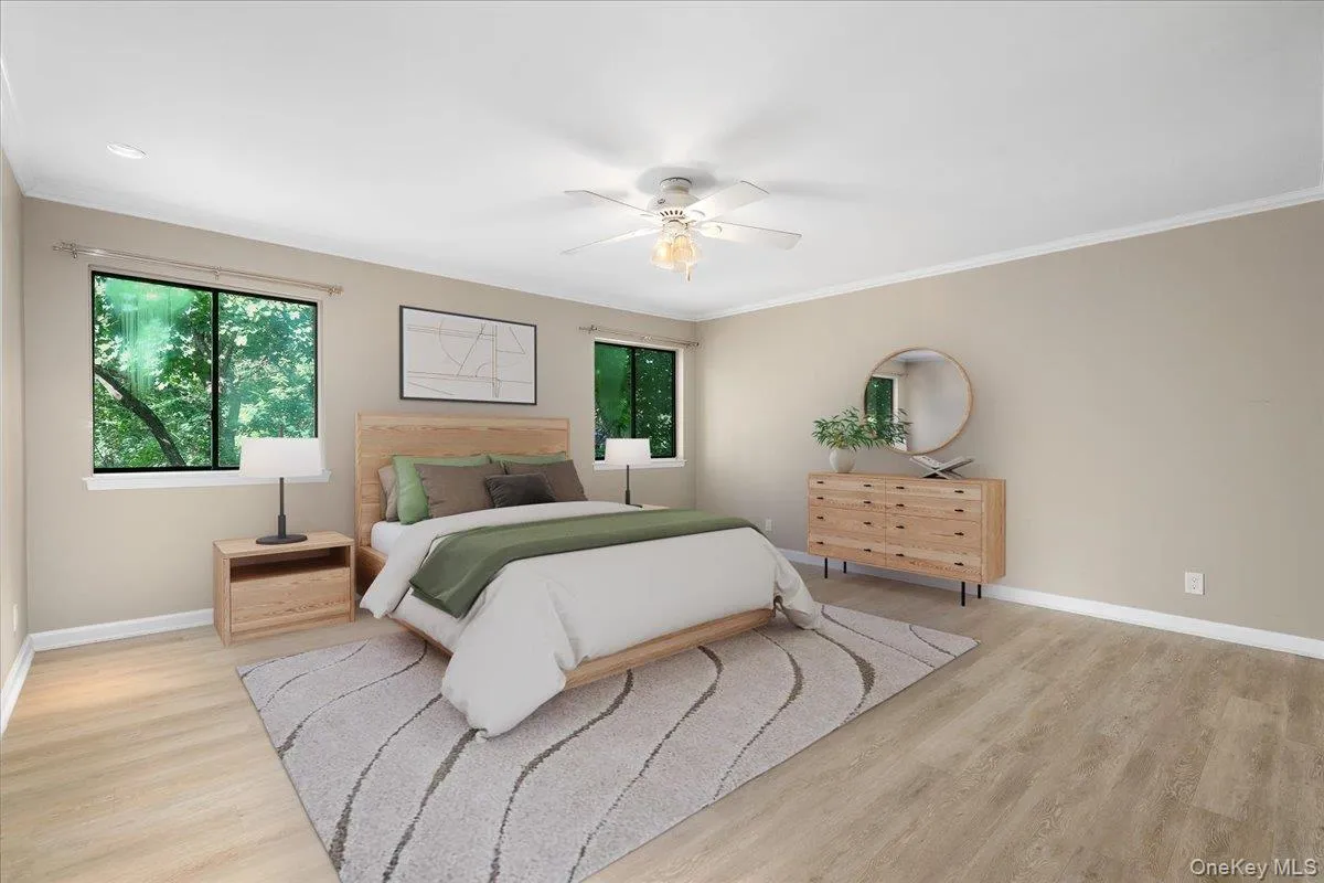 Oversized primary suite with room for a sitting area, desk, or additional furnishings. Oversized primary suite with room for a sitting area, desk, or additional furnishings.