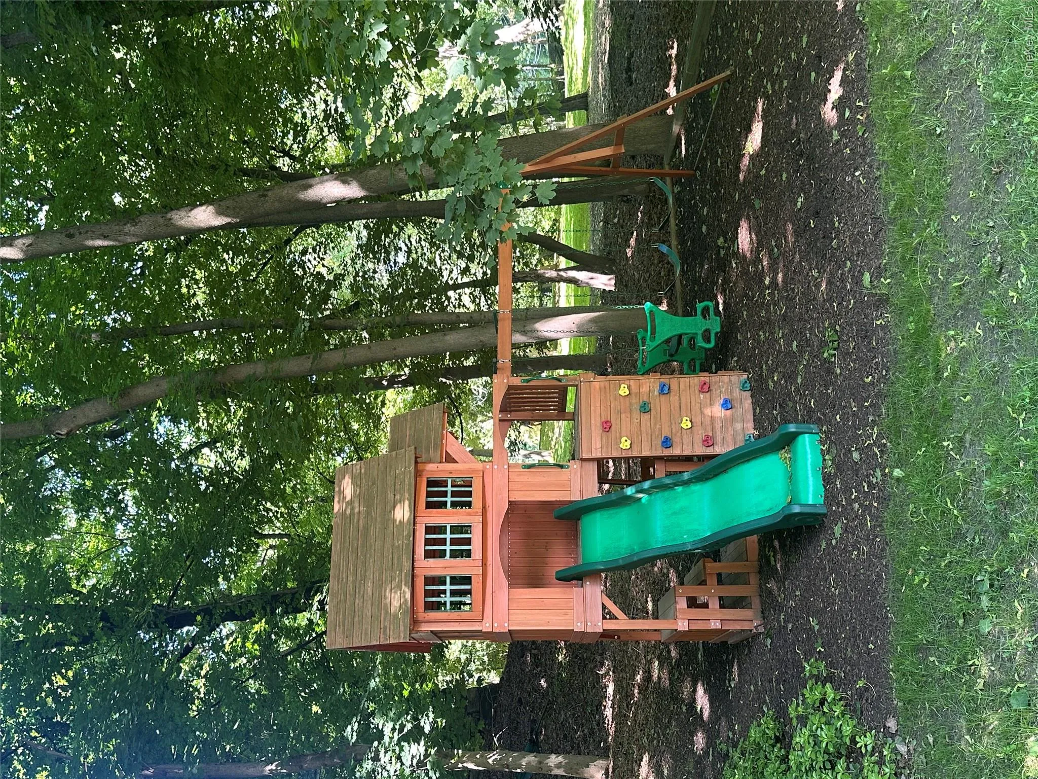Community playground tucked into a shaded, park-like setting. Community playground tucked into a shaded, park-like setting.