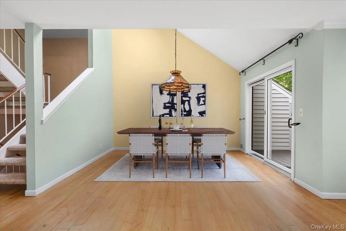 Open dining area with hardwood floors and a graceful connection to the living room. Open dining area with hardwood floors and a graceful connection to the living room.