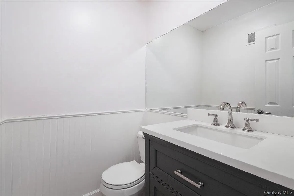 Updated powder room conveniently located on the main level. Updated powder room conveniently located on the main level.