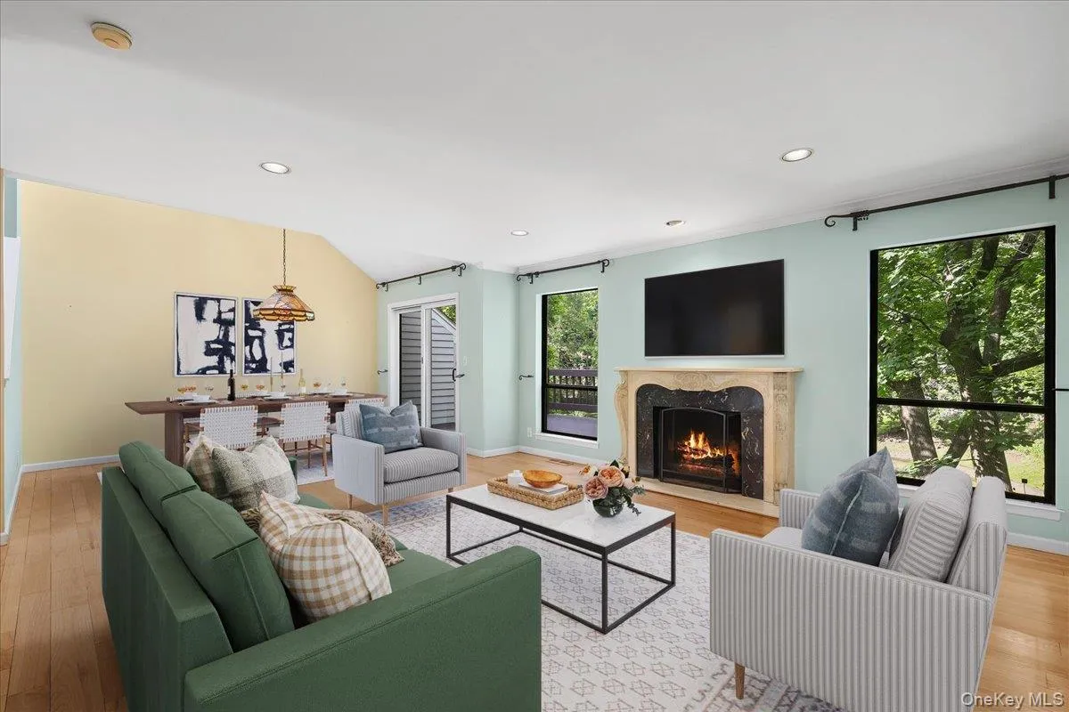 Light-filled living room offering comfortable space for everyday living and entertaining. Light-filled living room offering comfortable space for everyday living and entertaining.