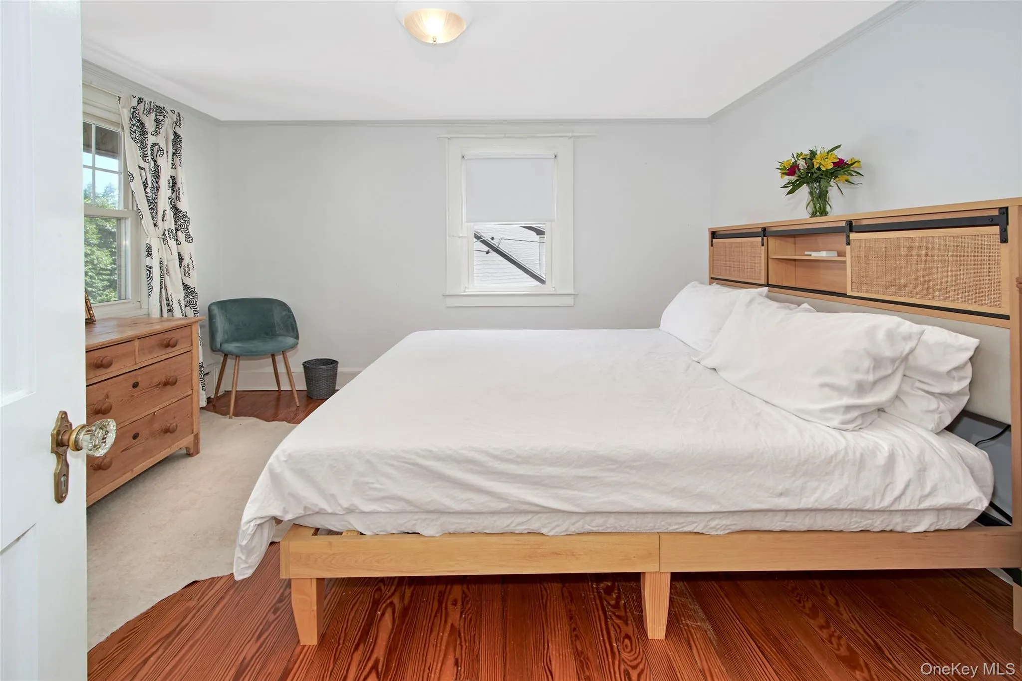 Generously sized and filled with natural light, this beautifully furnished bedroom features a king-size bed, hardwood floors, and a calming atmosphere. Designed to provide comfort and flexibility, it offers an inviting retreat for guests and everyday living. Generously sized and filled with natural light, this beautifully furnished bedroom features a king-size bed, hardwood floors, and a calming atmosphere. Designed to provide comfort and flexibility, it offers an inviting retreat for guests and everyday living.