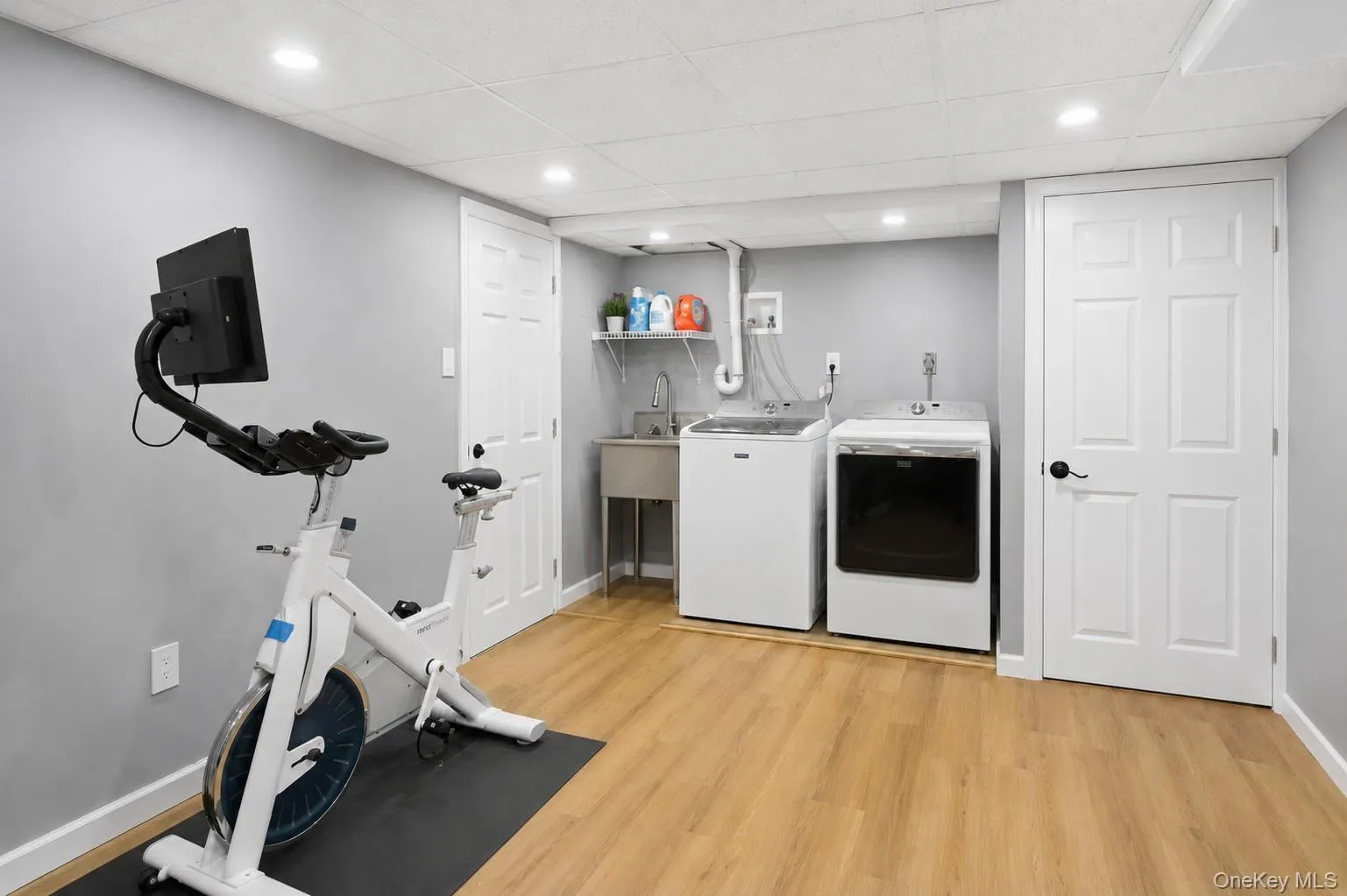 Large Laundry room featuring a utility sink and abundant storage Large Laundry room featuring a utility sink and abundant storage