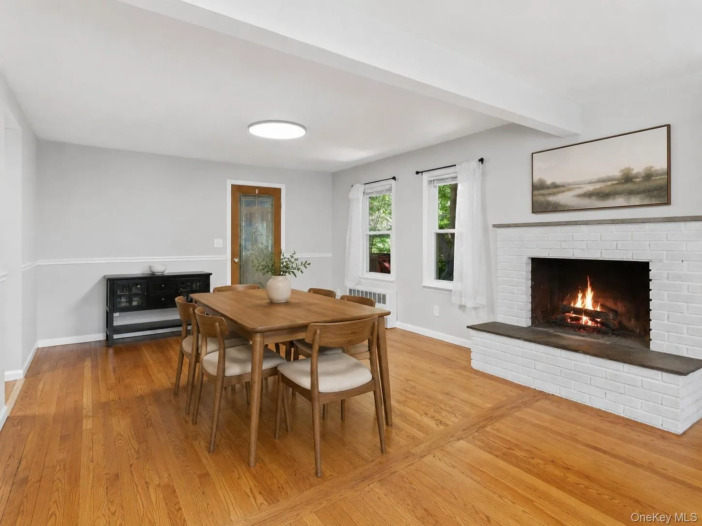 Spacious Dining Room with fireplace with Hardwood floors and cozy Fireplace Spacious Dining Room with fireplace with Hardwood floors and cozy Fireplace