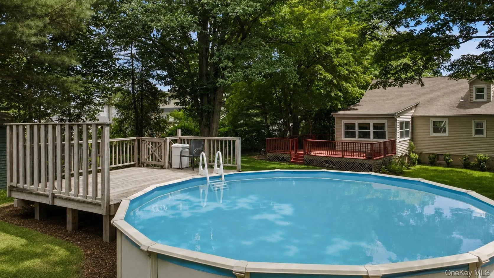 Private level backyard, Complete with an above-ground pool, this private outdoor oasis is perfect for entertaining, relaxing, gardening, or cooling off on hot summer days. Private level backyard, Complete with an above-ground pool, this private outdoor oasis is perfect for entertaining, relaxing, gardening, or cooling off on hot summer days.