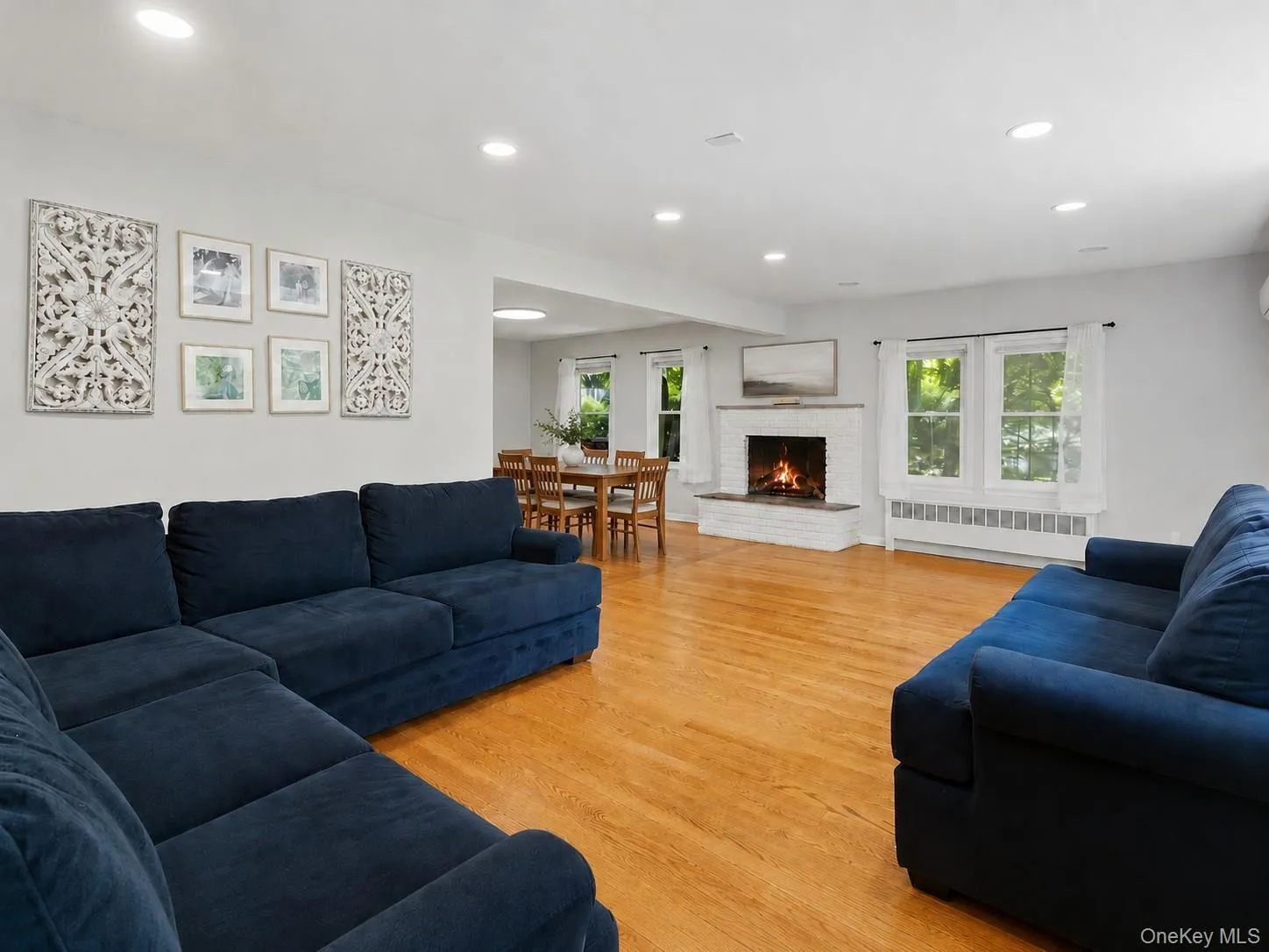 Sun-filled Living room with Hardwood floors and cozy Fireplace Sun-filled Living room with Hardwood floors and cozy Fireplace