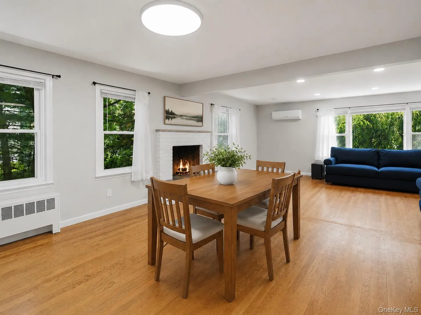 Spacious Dining Room with fireplace with Hardwood floors and cozy Fireplace Spacious Dining Room with fireplace with Hardwood floors and cozy Fireplace