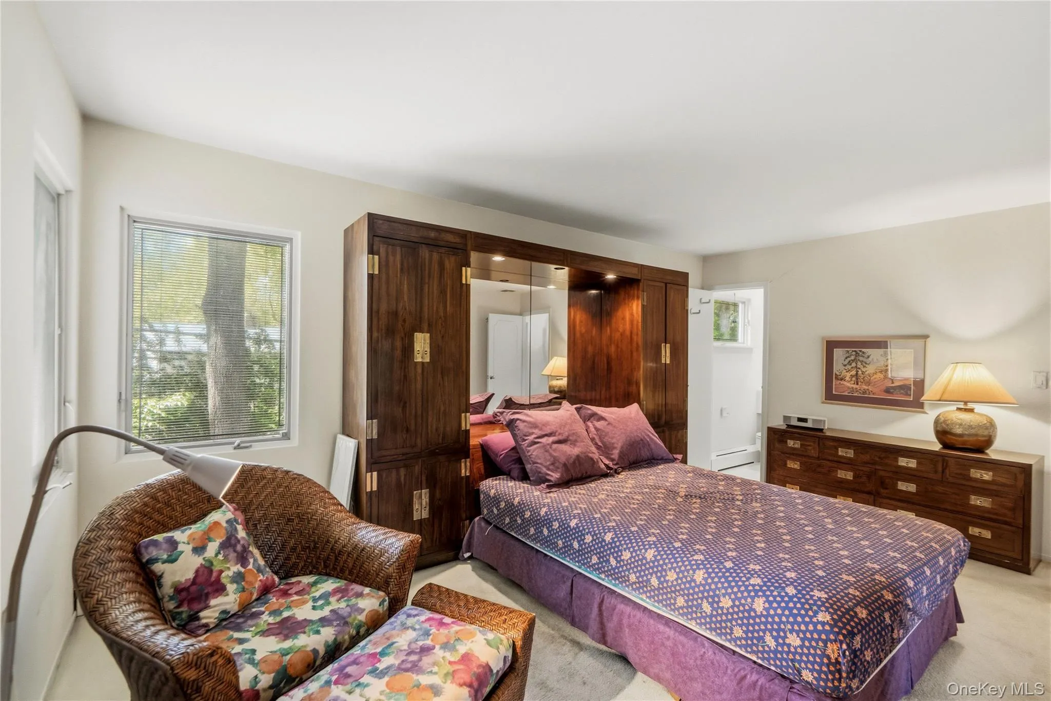 Large, bright primary bedroom, with full bath, and lovely backyard views Large, bright primary bedroom, with full bath, and lovely backyard views