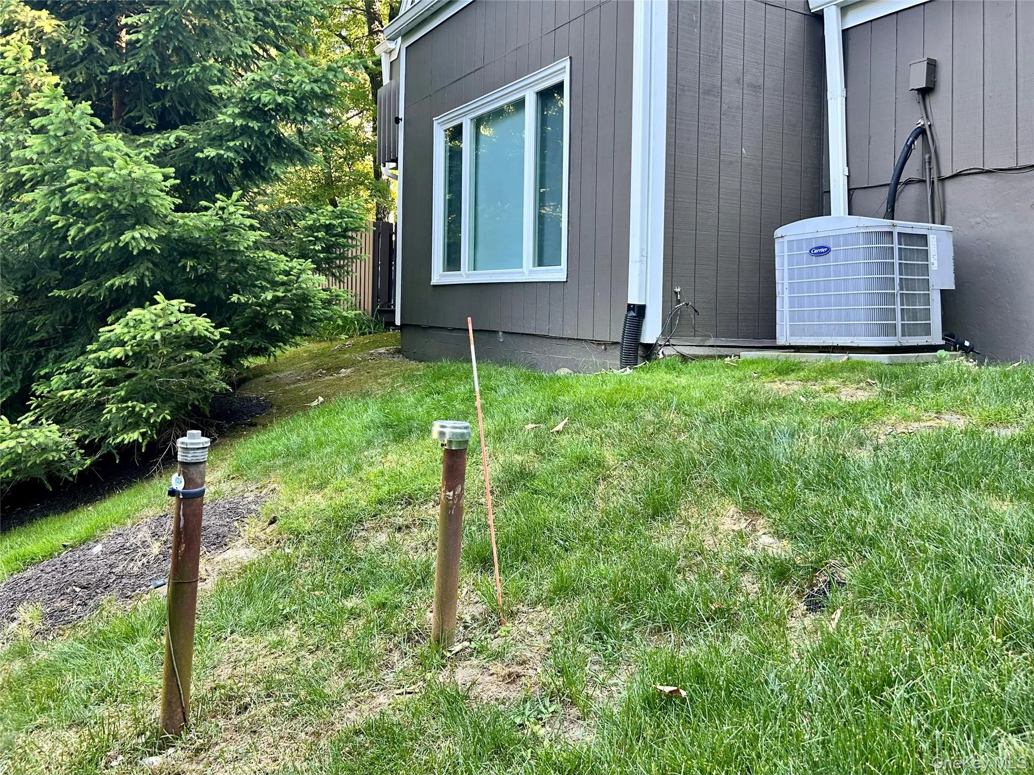 Marker for underground Location of Oil Tank, behind the Garage Marker for underground Location of Oil Tank, behind the Garage