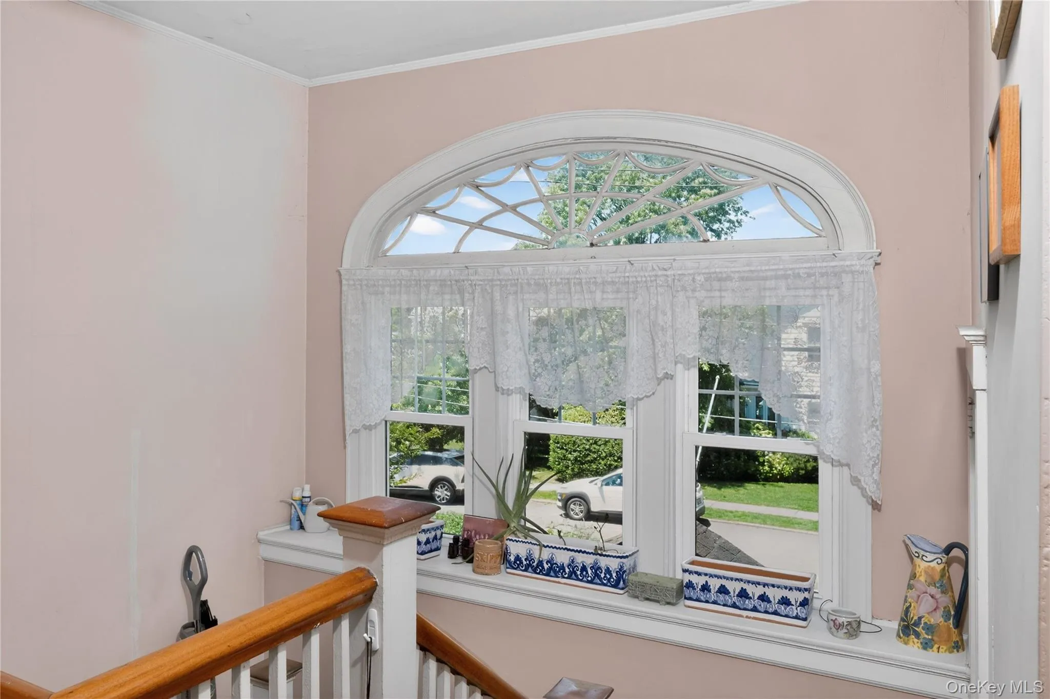 two story staircase with arched Paladian window Landing with two story staircase with arched Paladian window Landing with