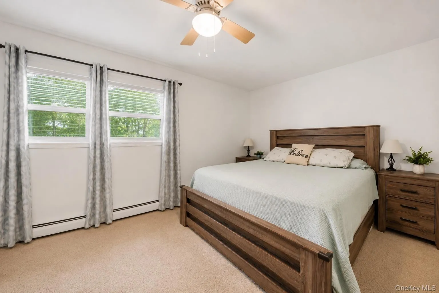 Wall-to-wall carpeting and a ceiling fan with integrated lighting Wall-to-wall carpeting and a ceiling fan with integrated lighting