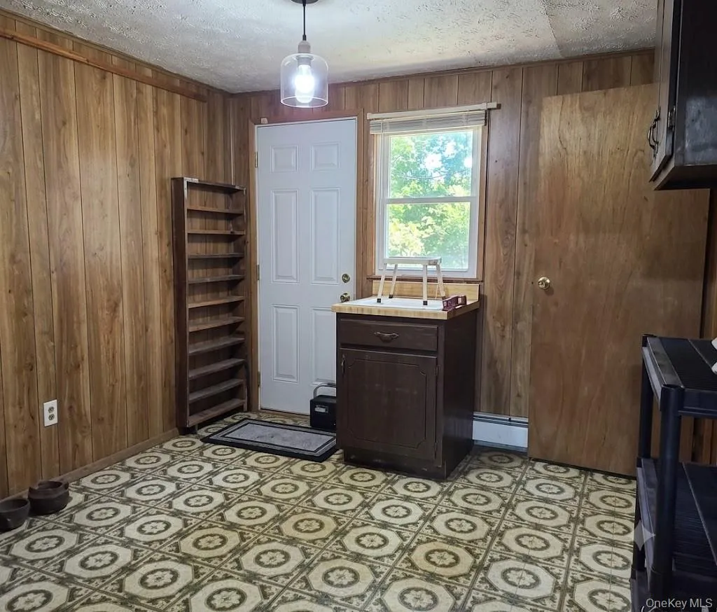 The Lower Level Also Offers A Fifth Bedroom/Office Or Utility Room With A Good Sized Closet & An Outside Entrance. The Lower Level Also Offers A Fifth Bedroom/Office Or Utility Room With A Good Sized Closet & An Outside Entrance.
