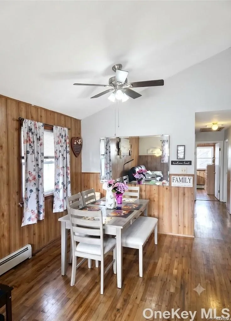 The Comfortable Dining Room Offers Vaulted Ceilings, Ceiling Fan, Beautiful Hardwood Floors, Double Window For Natural Light, Room For A Good Sized Table & Chairs, And Opens Into The Kitchen. The Comfortable Dining Room Offers Vaulted Ceilings, Ceiling Fan, Beautiful Hardwood Floors, Double Window For Natural Light, Room For A Good Sized Table & Chairs, And Opens Into The Kitchen.