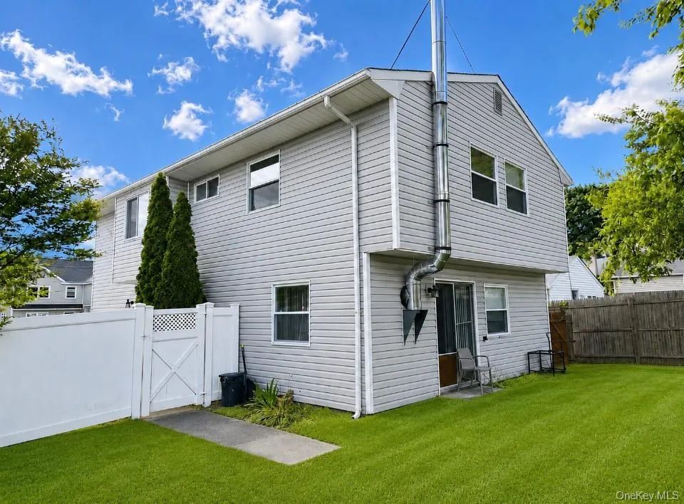 The Back Of The Home Offers Several Outside Entrances & A Fully Fenced Backyard With A Double Sized Side Gate - Perfect For A Boat, Trailer Or Possible Second Driveway. The Back Of The Home Offers Several Outside Entrances & A Fully Fenced Backyard With A Double Sized Side Gate - Perfect For A Boat, Trailer Or Possible Second Driveway.