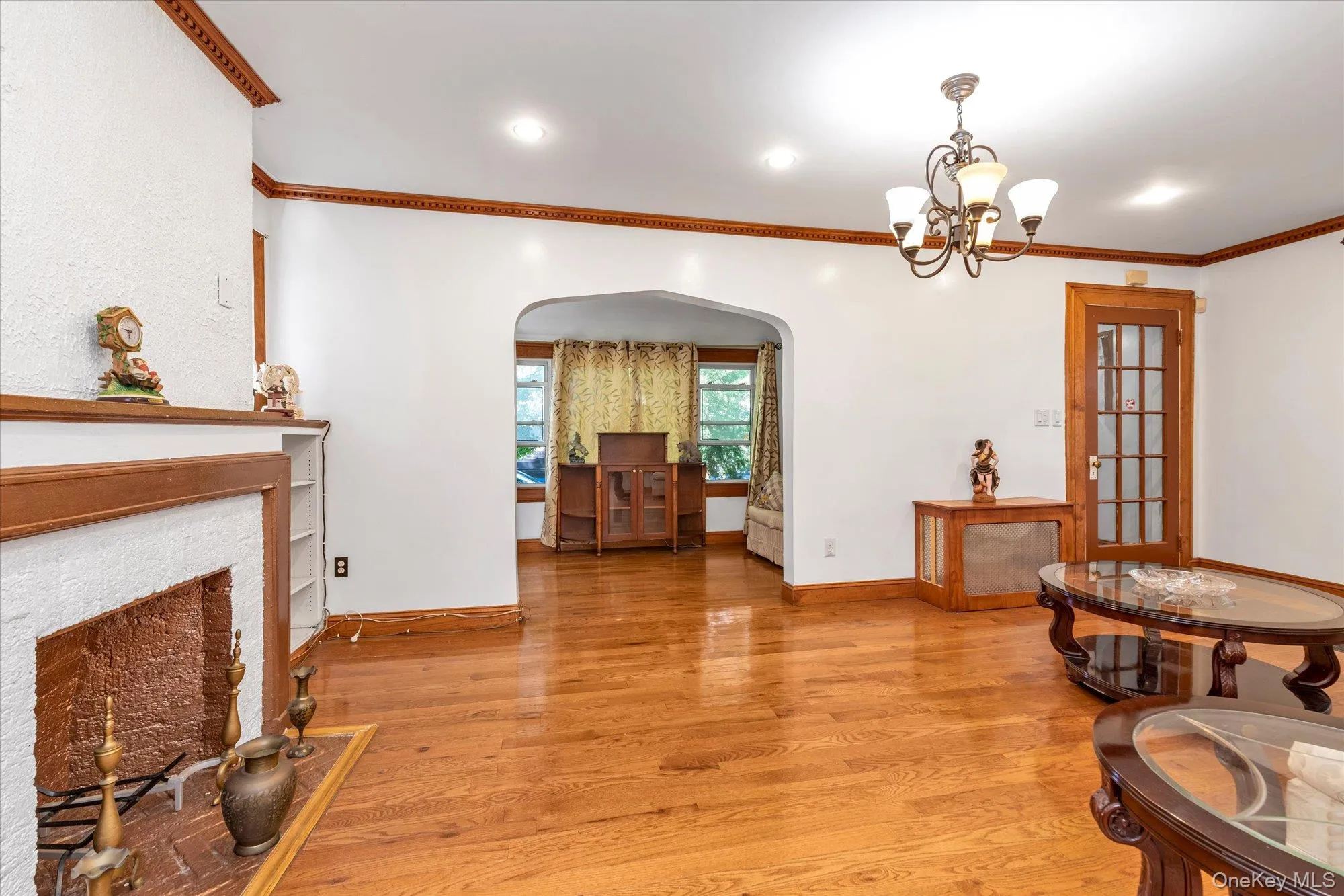 Living room with wood burning fireplace. Living room with wood burning fireplace.