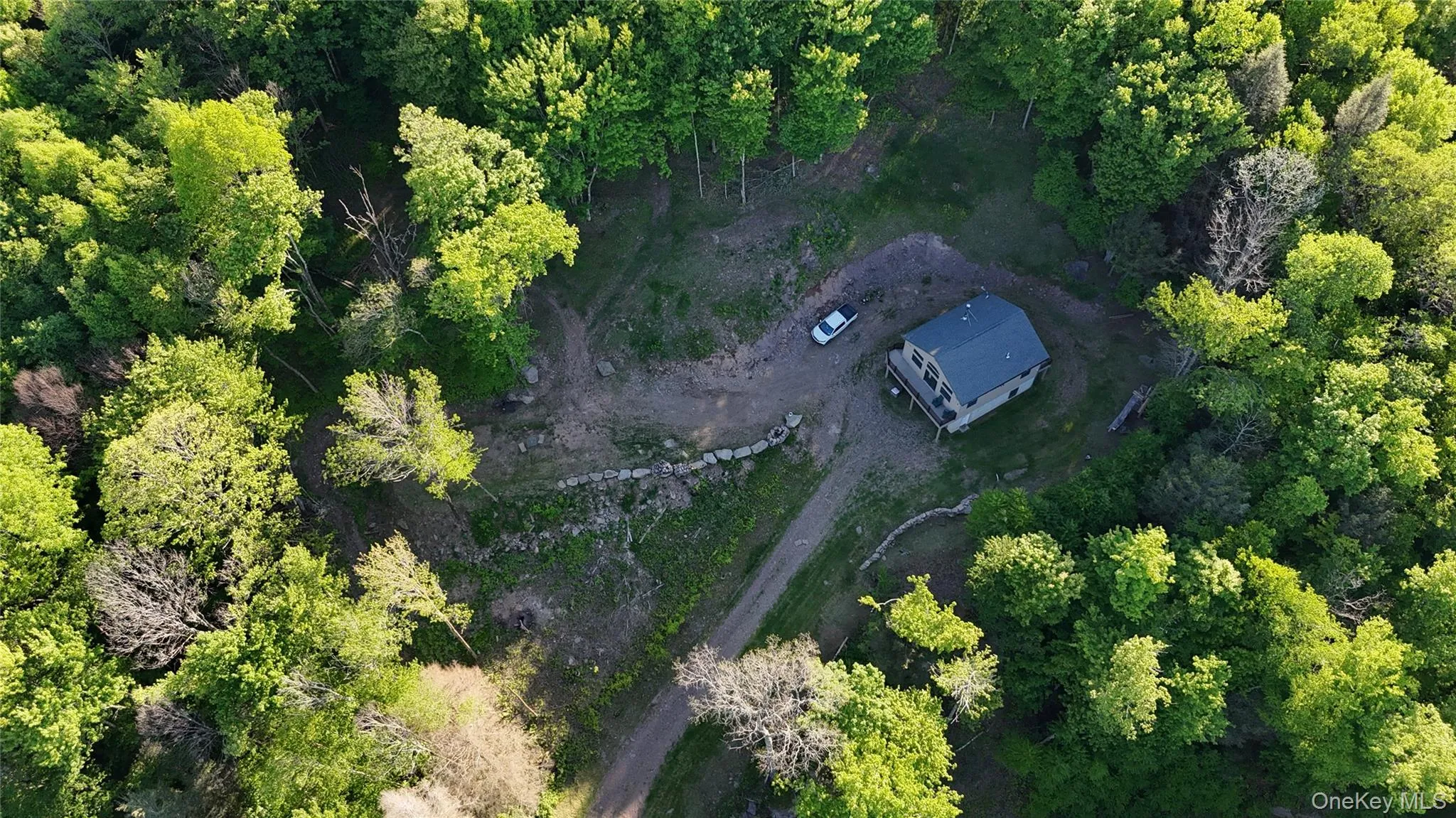 Aerial of house and surrounding landscape Aerial of house and surrounding landscape