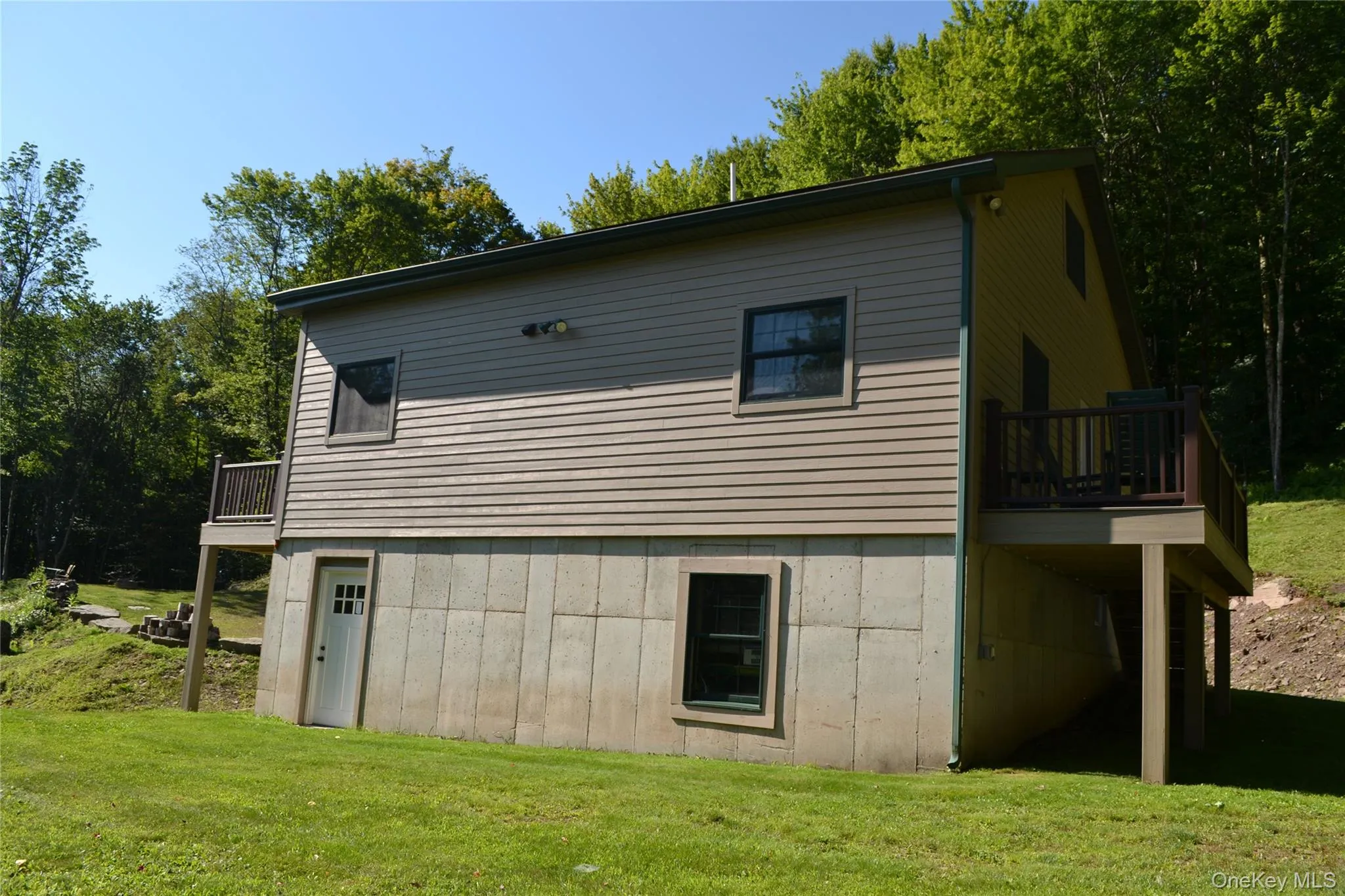Side of home with garage access Side of home with garage access