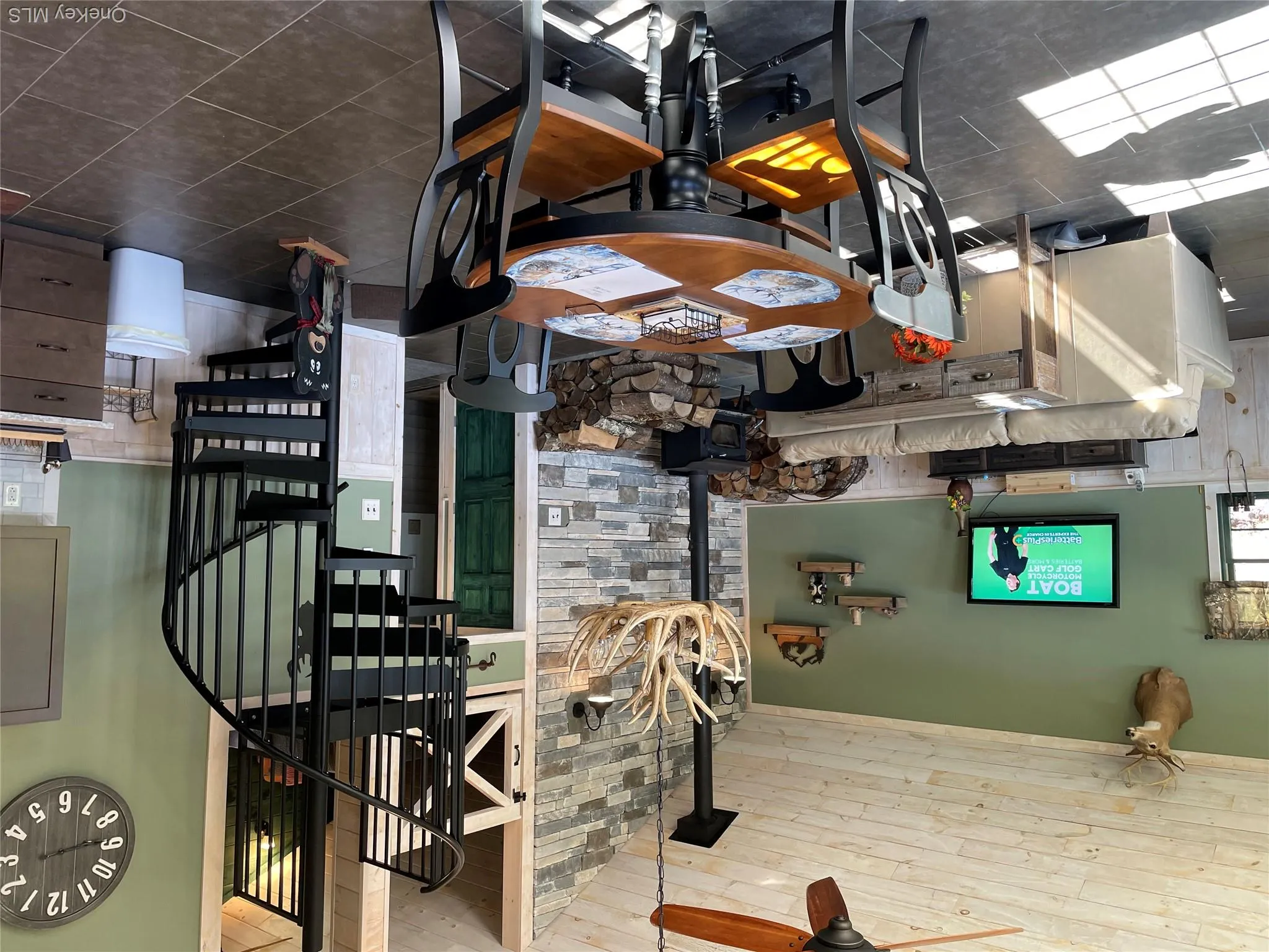 Spiral staircase, dining area and living room Spiral staircase, dining area and living room