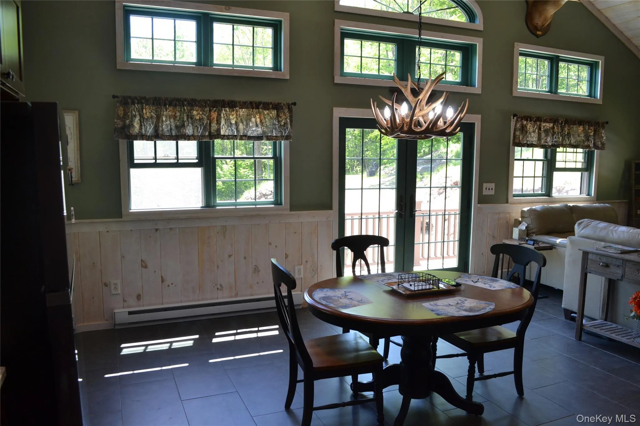 Dining area with sliders to deck Dining area with sliders to deck