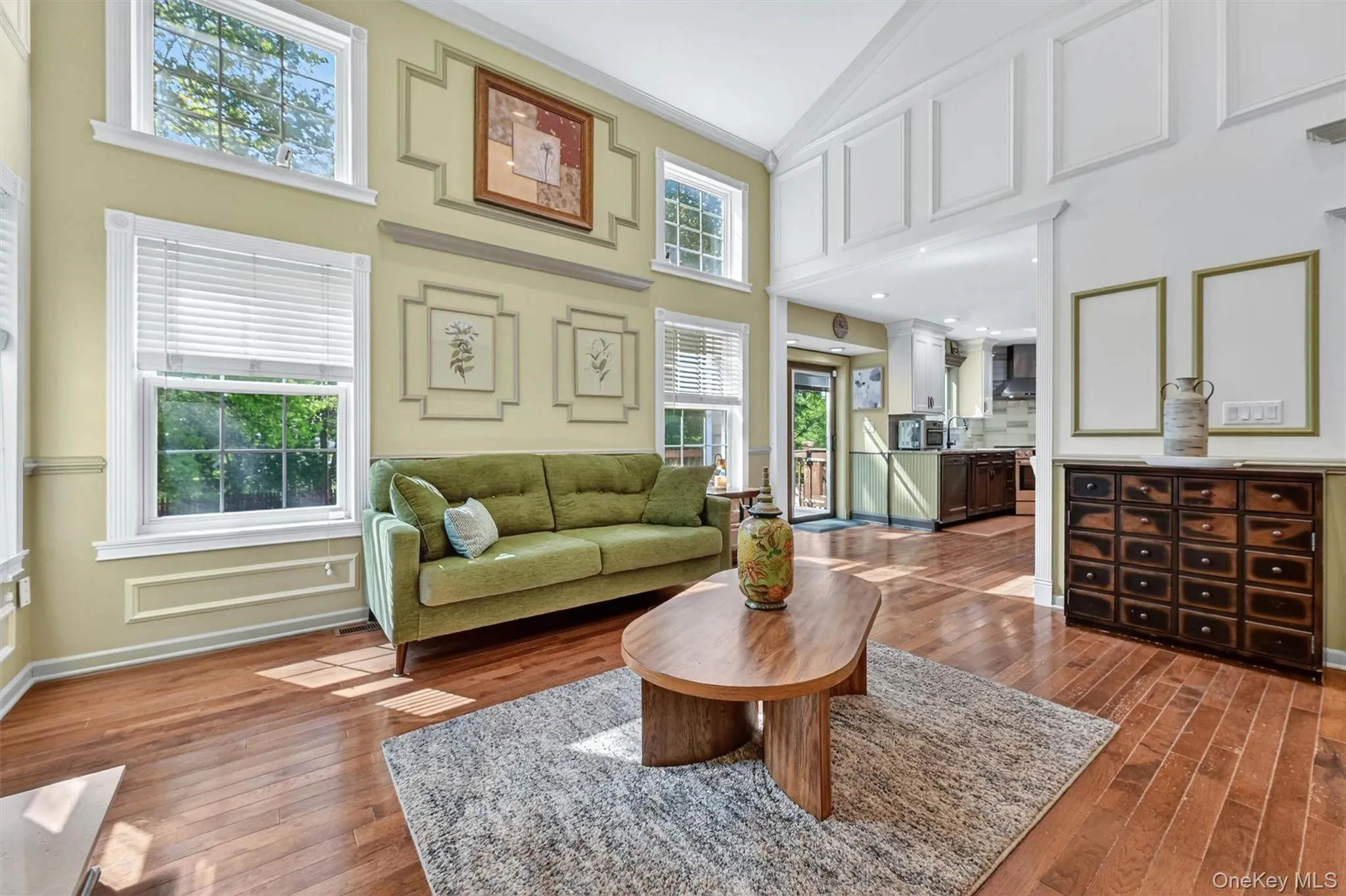 Two story windows bring in the sun and naturally light the room. Two story windows bring in the sun and naturally light the room.