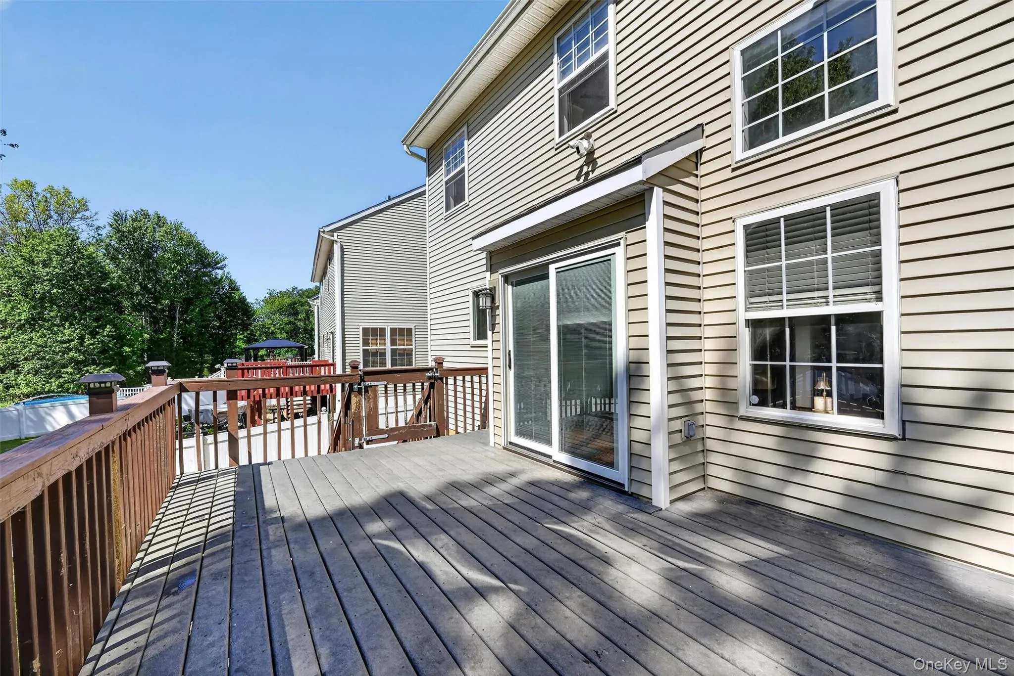 There is a gate at the end leading down to the back yard and lower patio. There is a gate at the end leading down to the back yard and lower patio.
