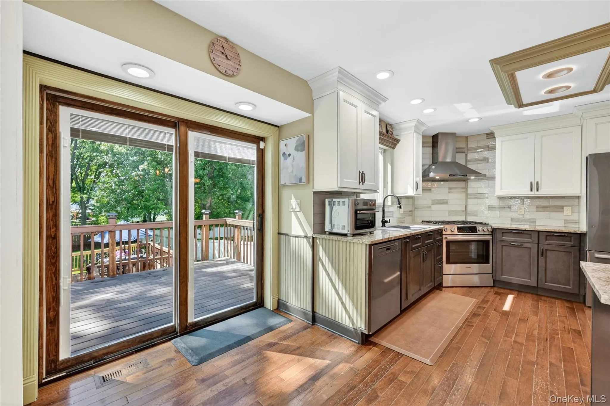 The sliding doors make it easy to dine alfresco. Good up to see recessed lights above the sliding doors. The sliding doors make it easy to dine alfresco. Good up to see recessed lights above the sliding doors.