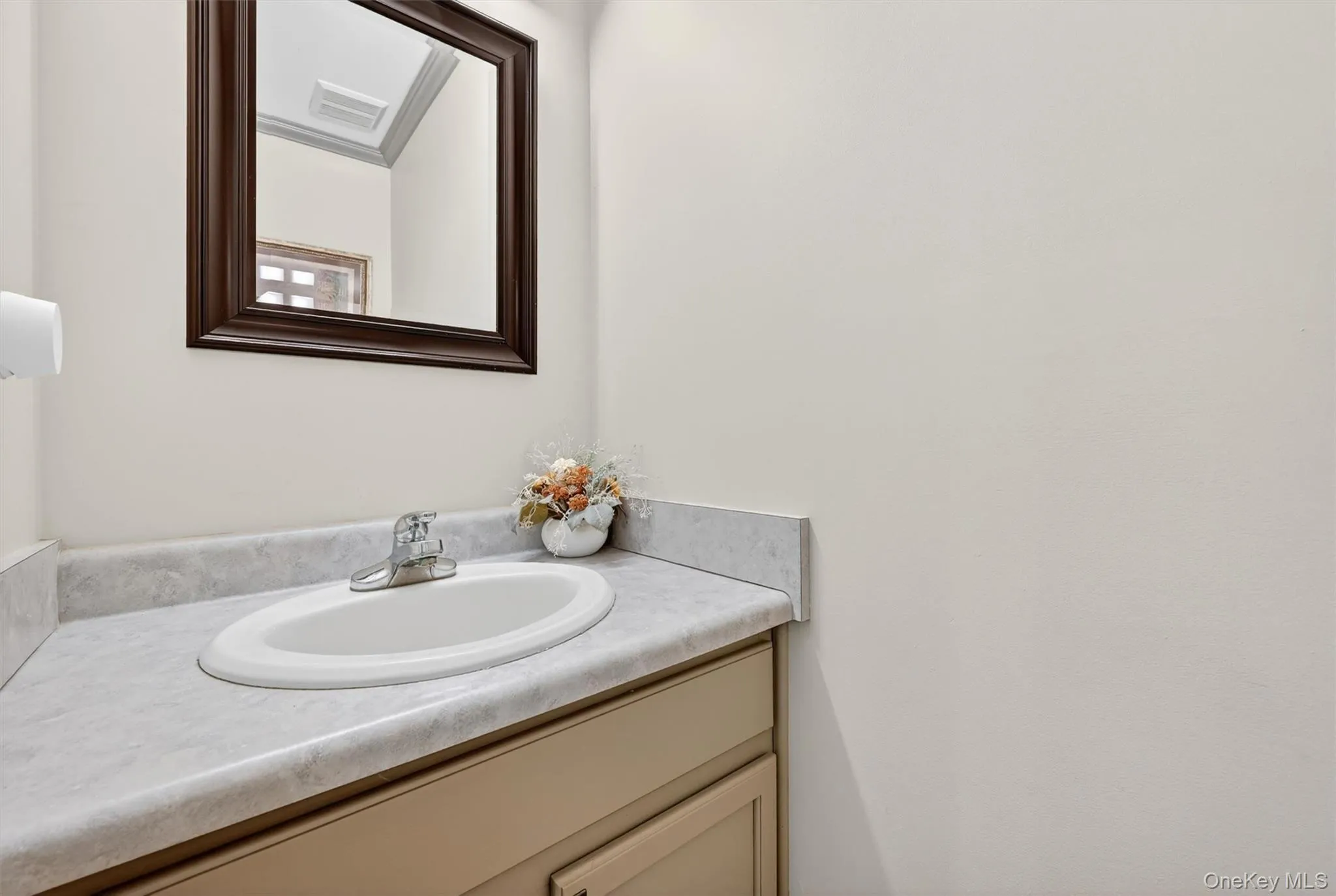 The main floor half bath is tucked away. The main floor half bath is tucked away.