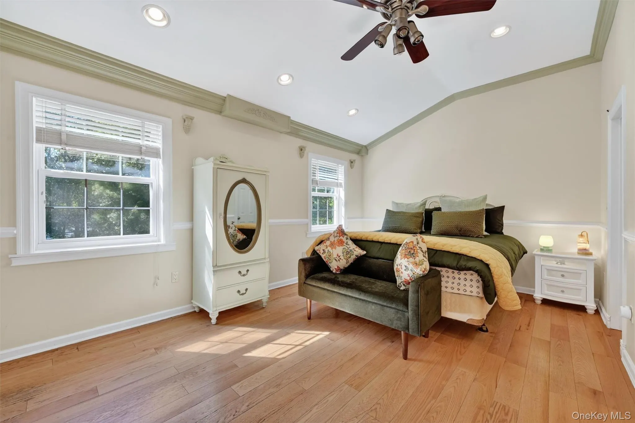 The spacious primary suite offers oversized windows and hardwood floors. The spacious primary suite offers oversized windows and hardwood floors.