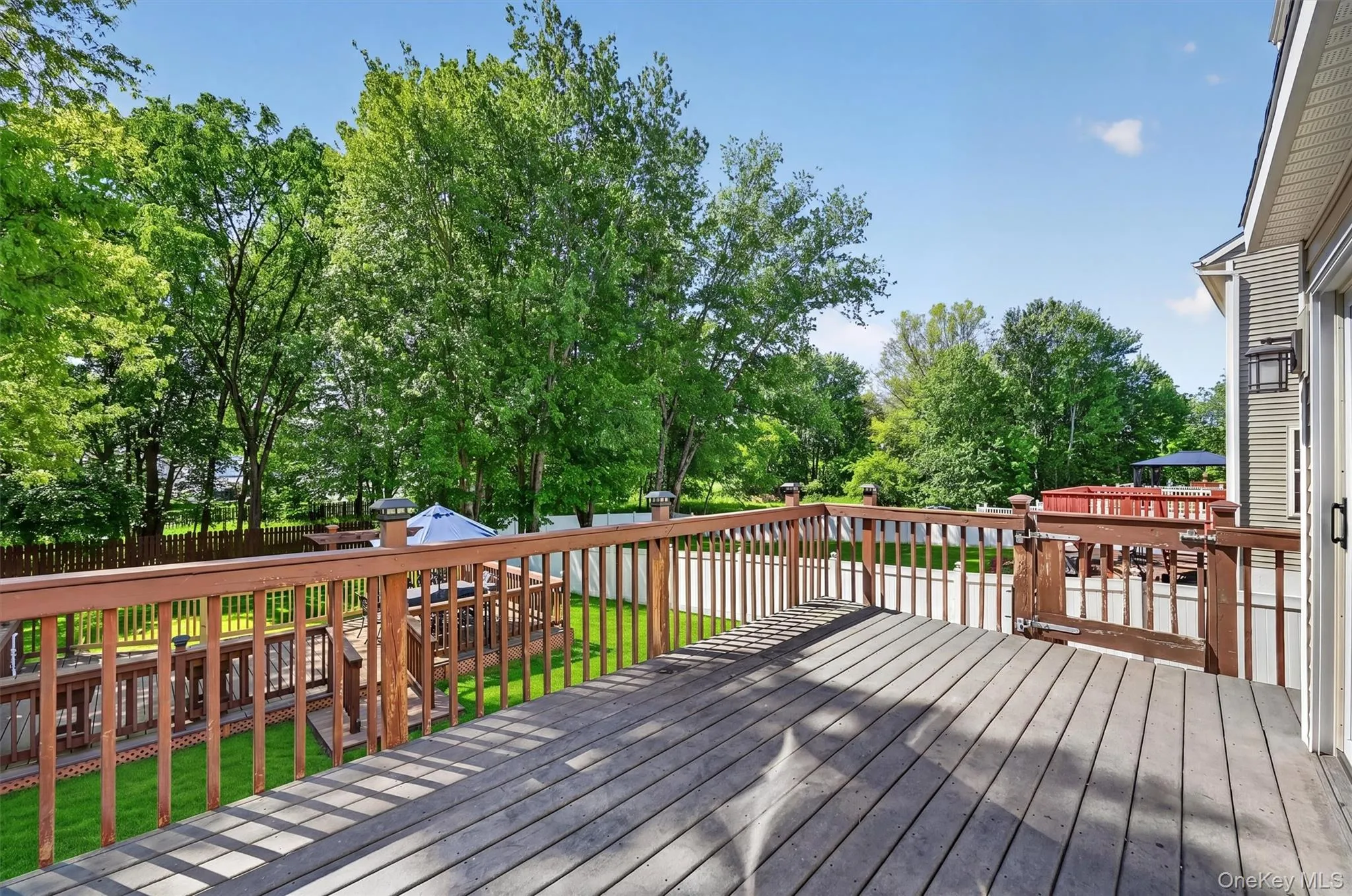 The large deck has plenty of room to dining and lounging furniture. The large deck has plenty of room to dining and lounging furniture.