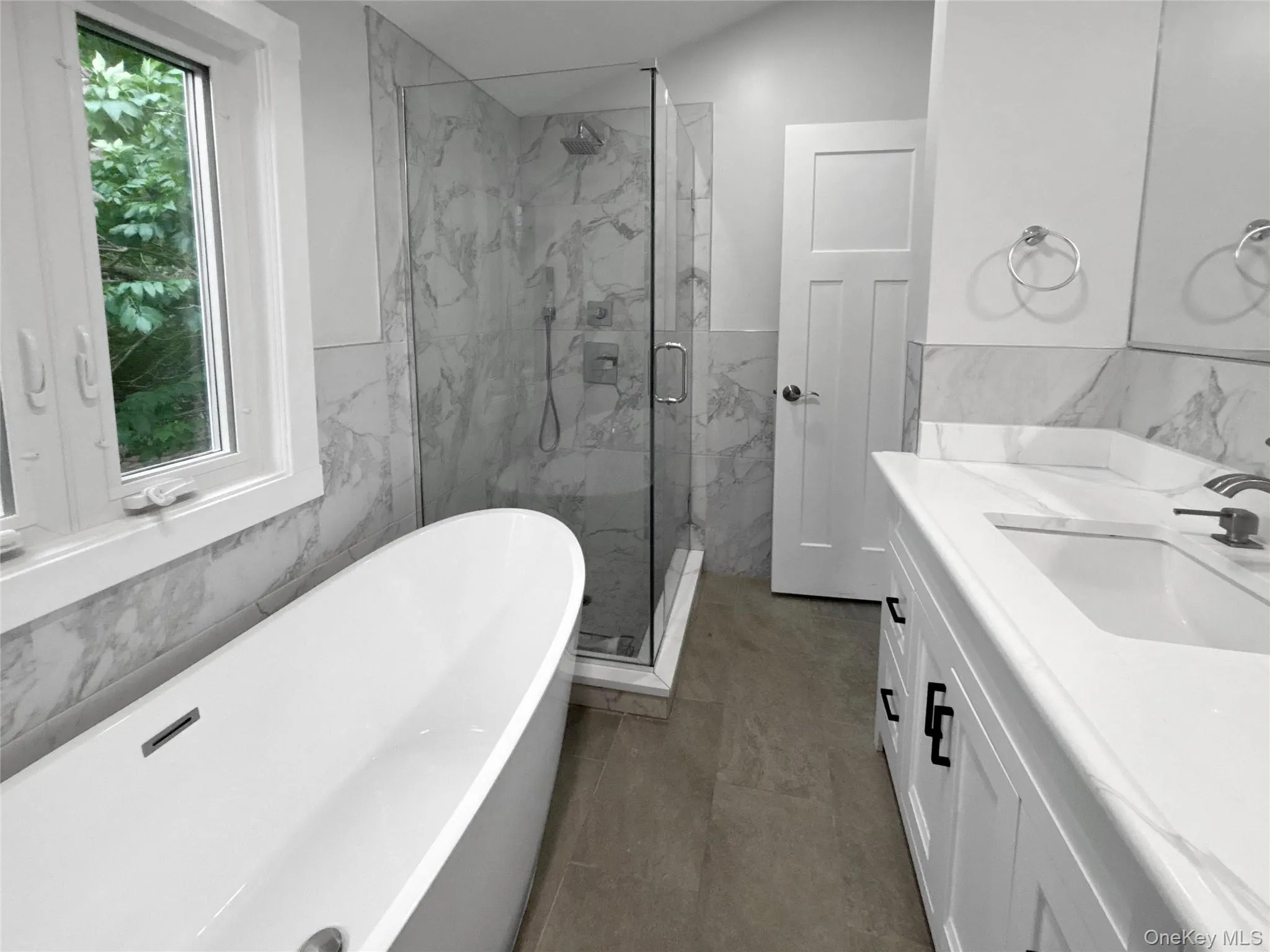 Full bathroom with bathtub and separate stall shower Full bathroom with bathtub and separate stall shower