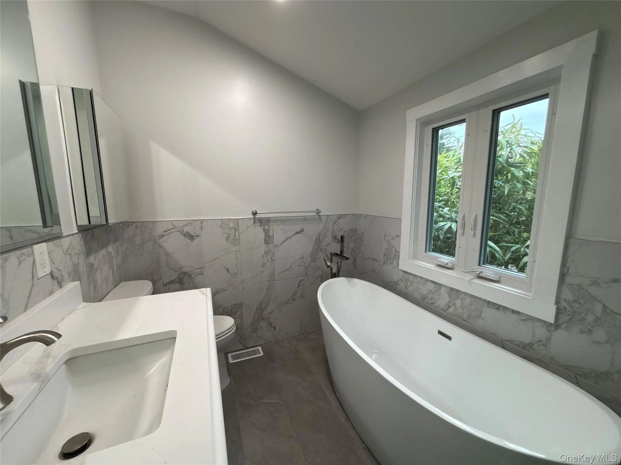Full bathroom with bathtub and separate stall shower Full bathroom with bathtub and separate stall shower