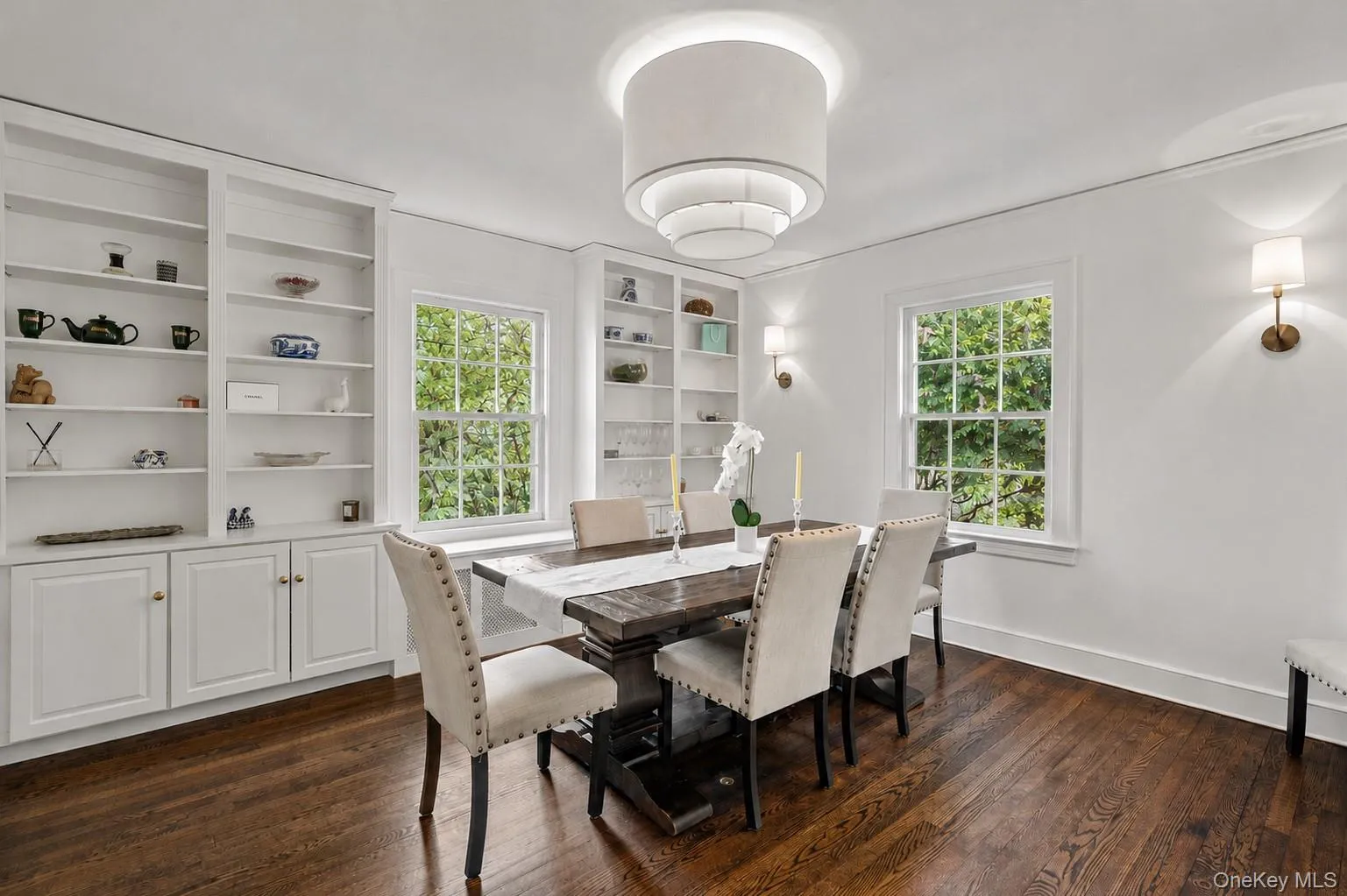 Hardwood flooring complements built-in shelving with lower cabinetry Hardwood flooring complements built-in shelving with lower cabinetry