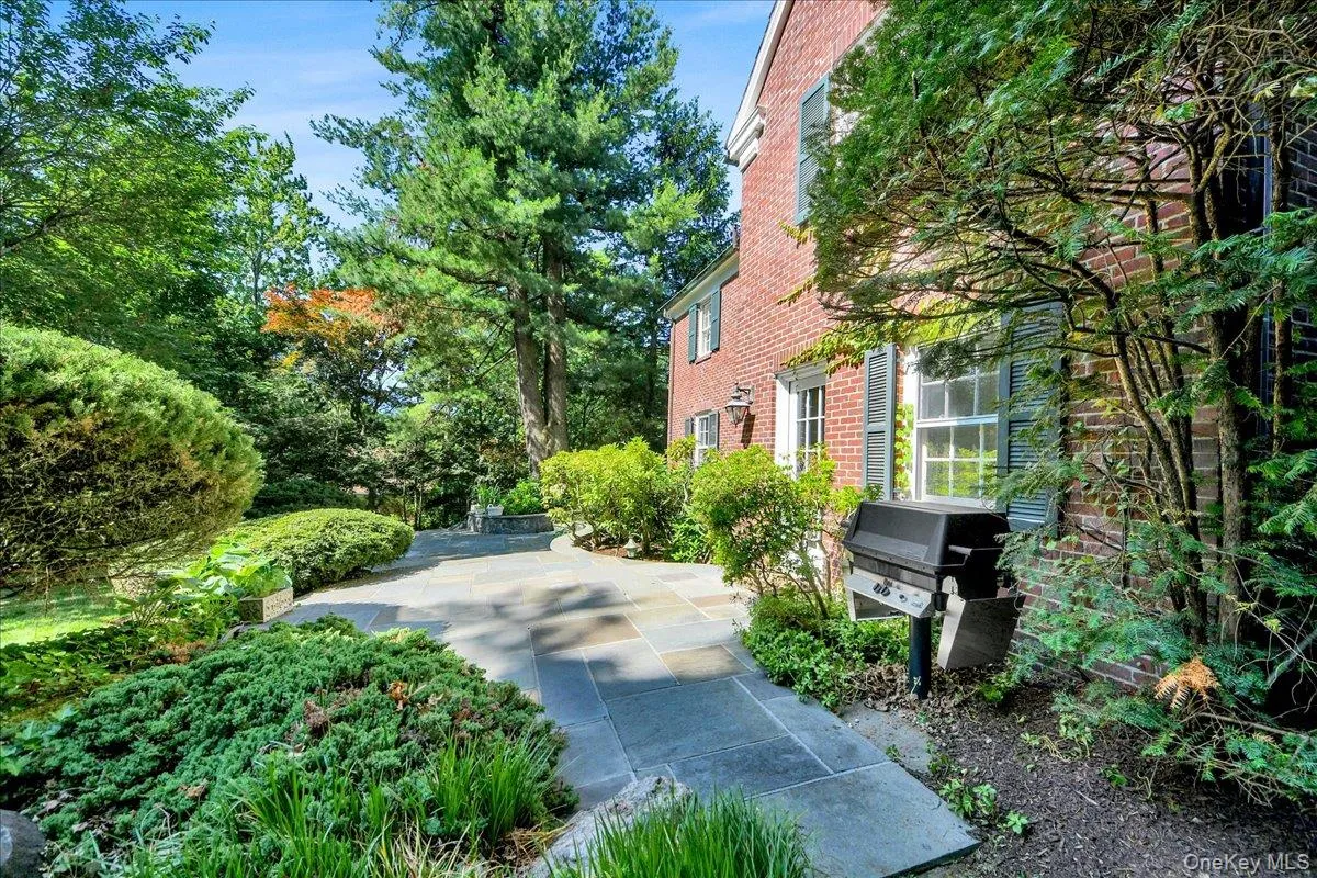 Backyard patio featuring landscaping and grill with dedicated gas line. Backyard patio featuring landscaping and grill with dedicated gas line.