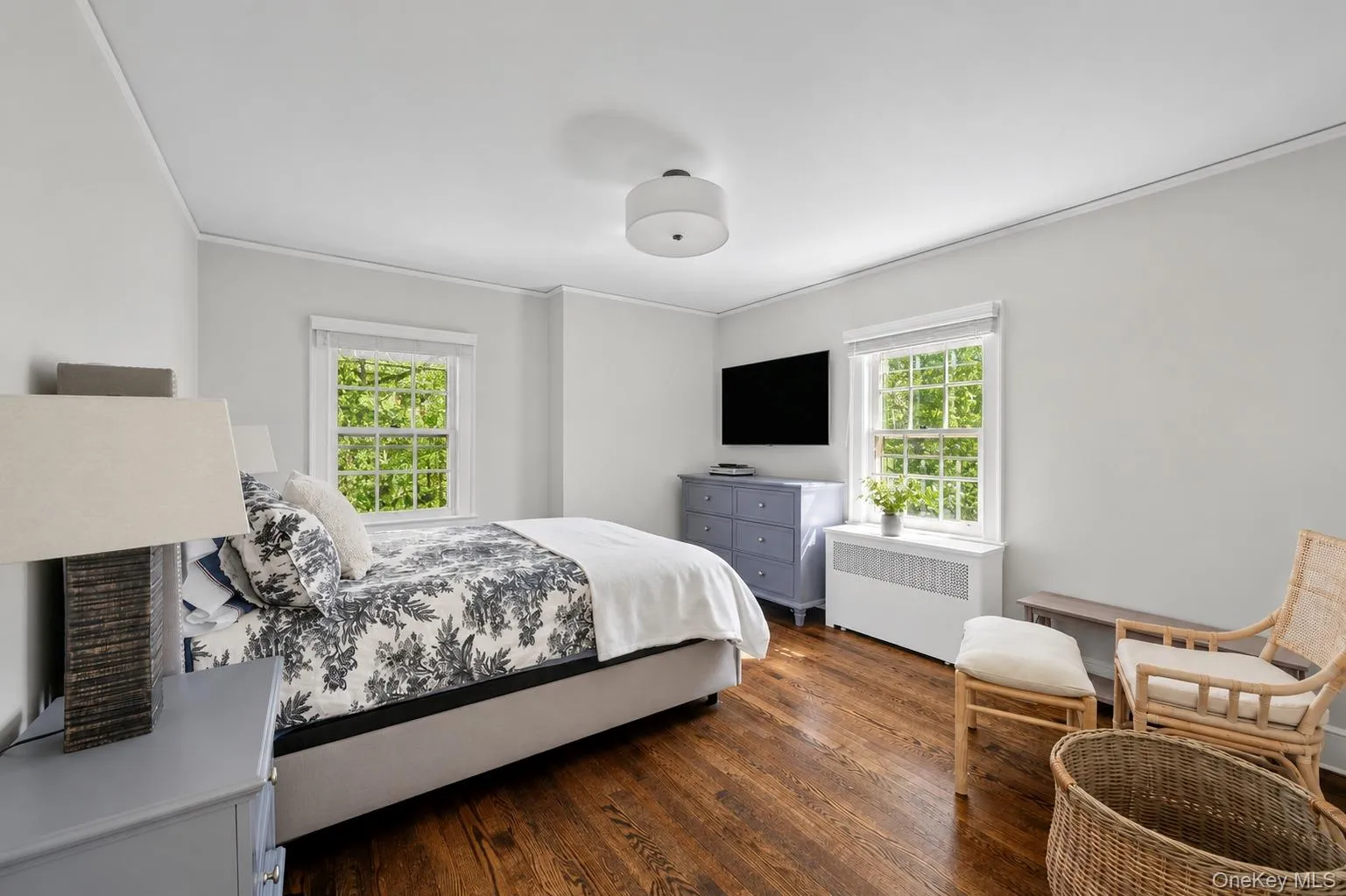 Hardwood flooring complements light-toned walls and crown molding Hardwood flooring complements light-toned walls and crown molding