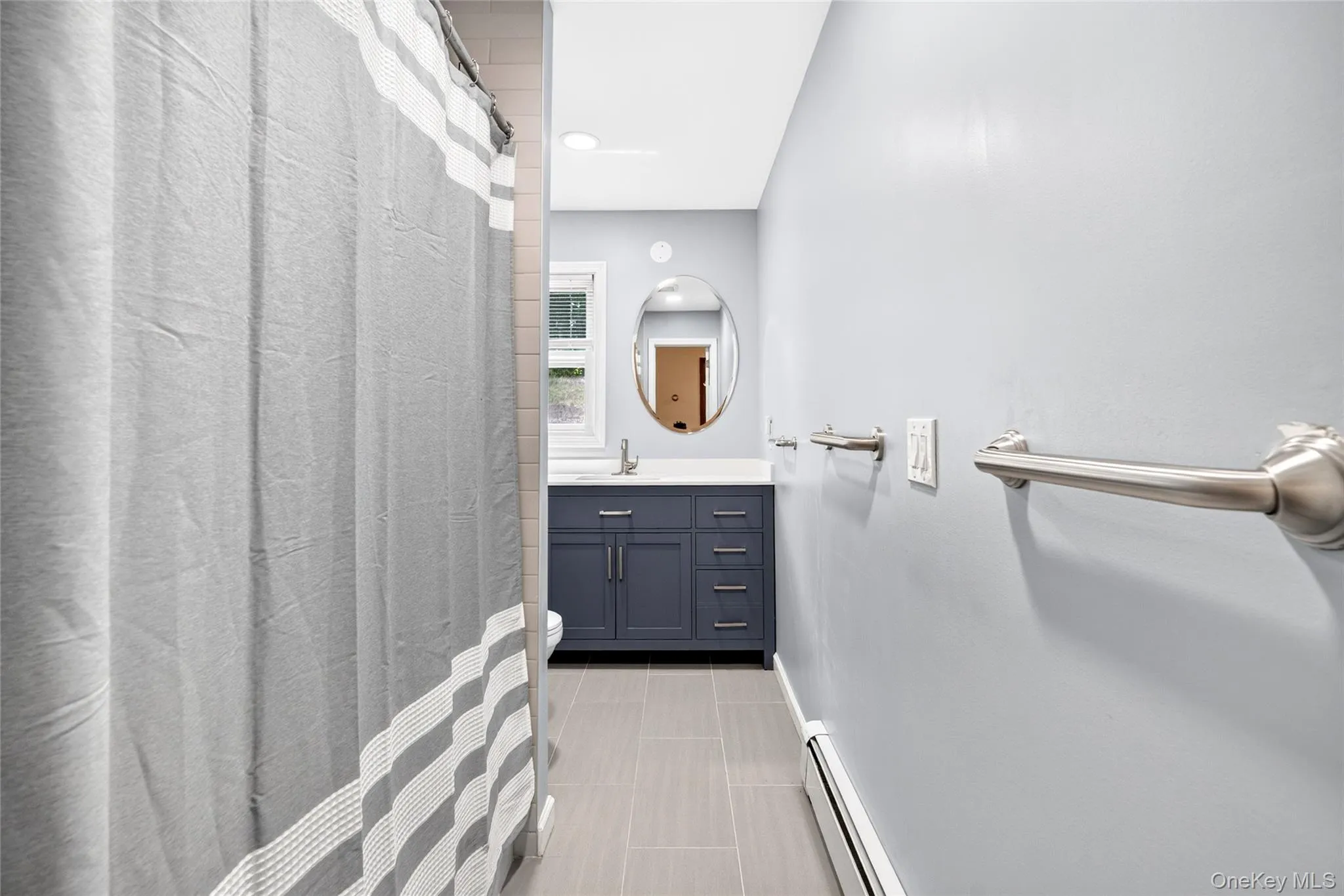 Main floor updated hallway bathroom with soaking tub Main floor updated hallway bathroom with soaking tub