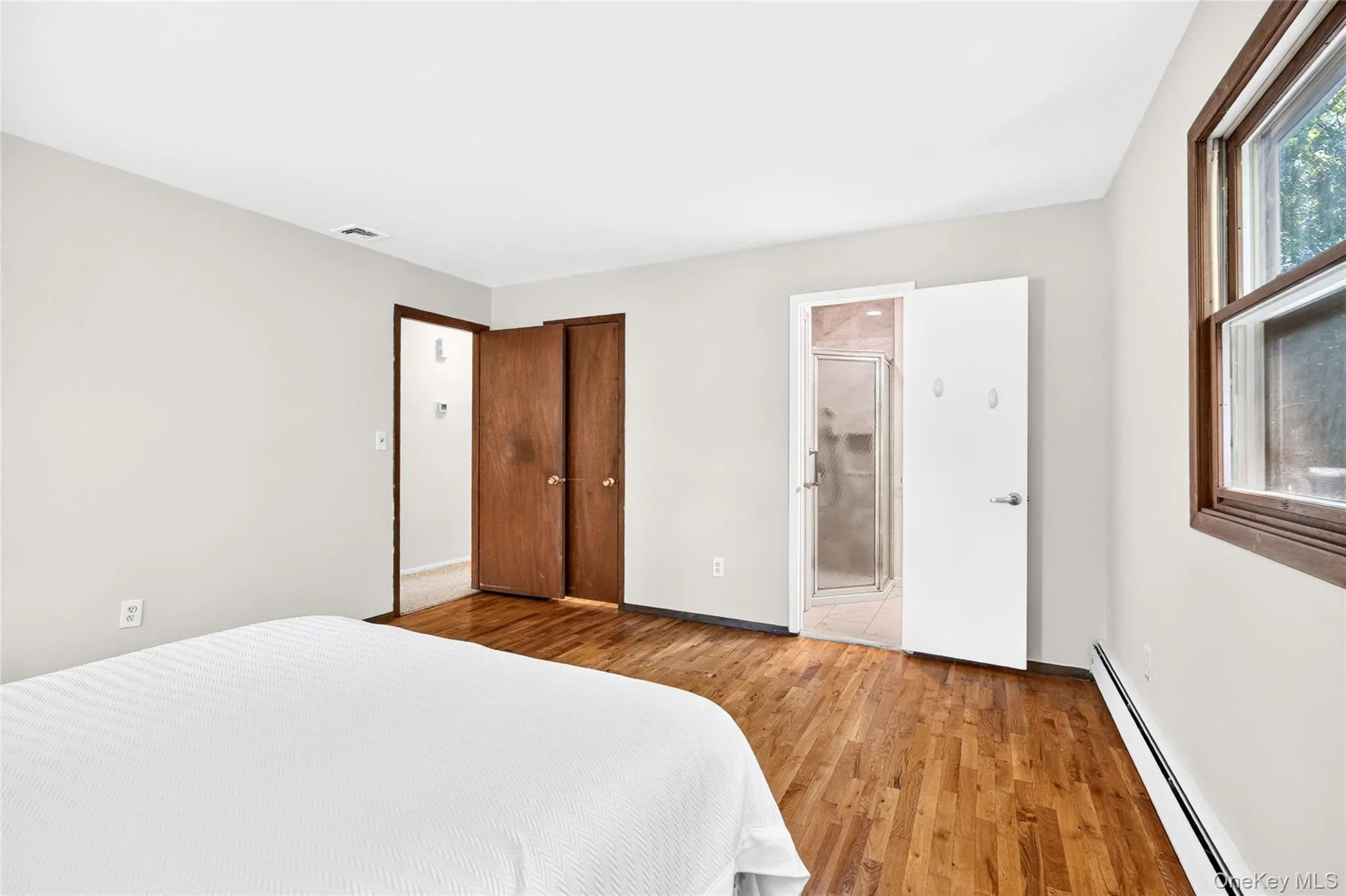 Primary bedroom with walk in closet & full primary bathroom Primary bedroom with walk in closet & full primary bathroom