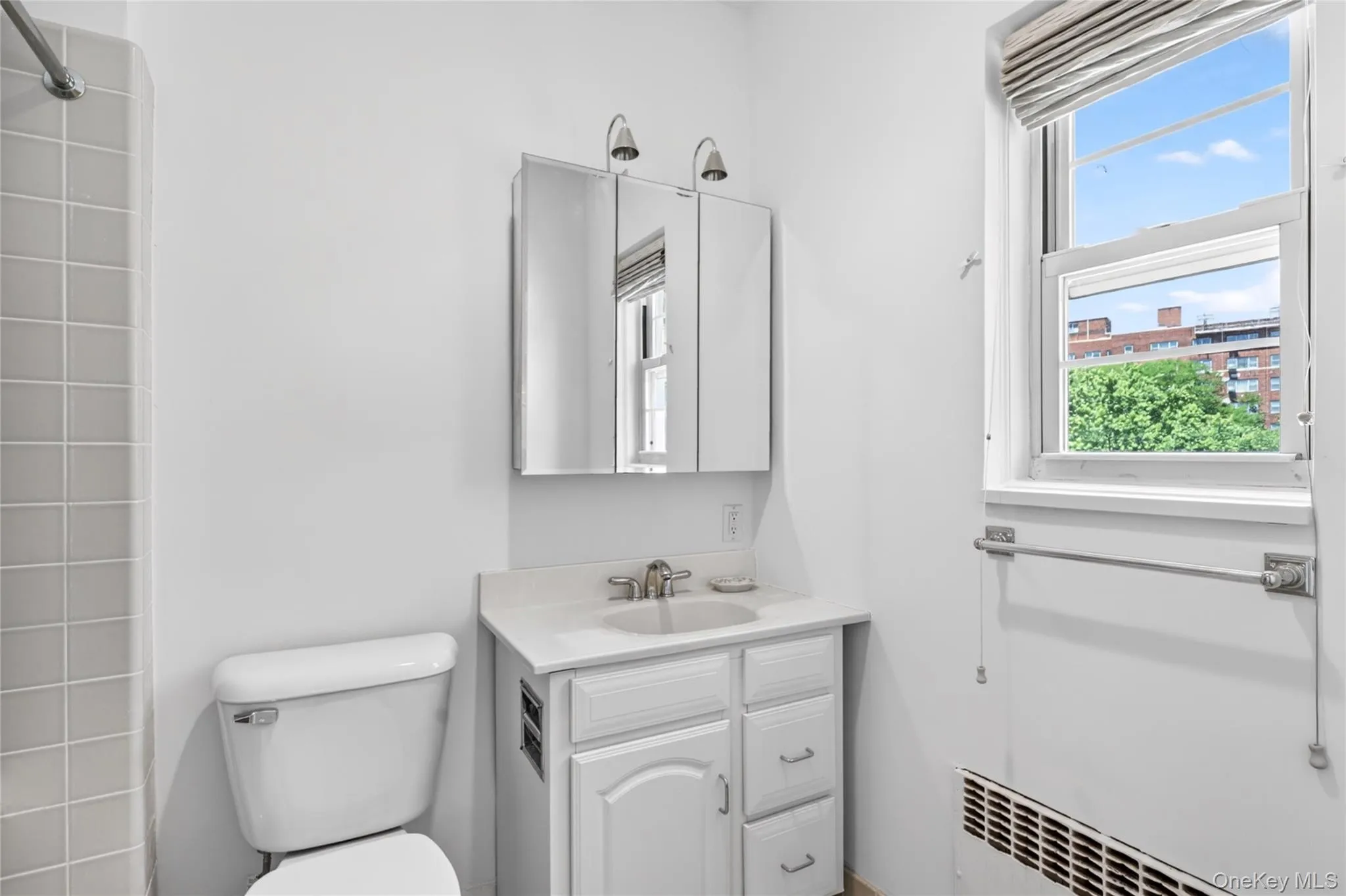 Primary Bathroom offers a bath with shower Primary Bathroom offers a bath with shower