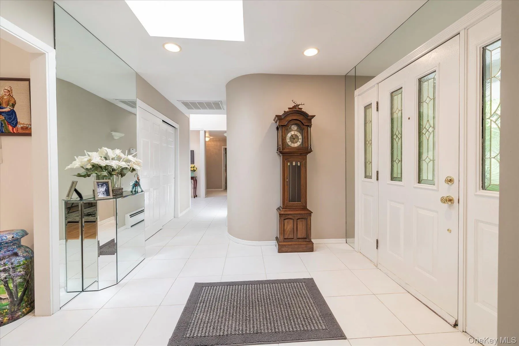Entry foyer with double closet and skylight Entry foyer with double closet and skylight
