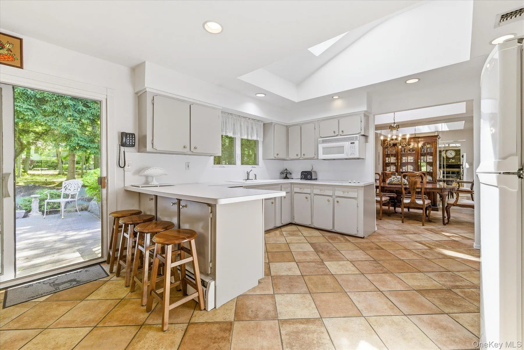 Eat-in kitchen with sliders to backyard Eat-in kitchen with sliders to backyard